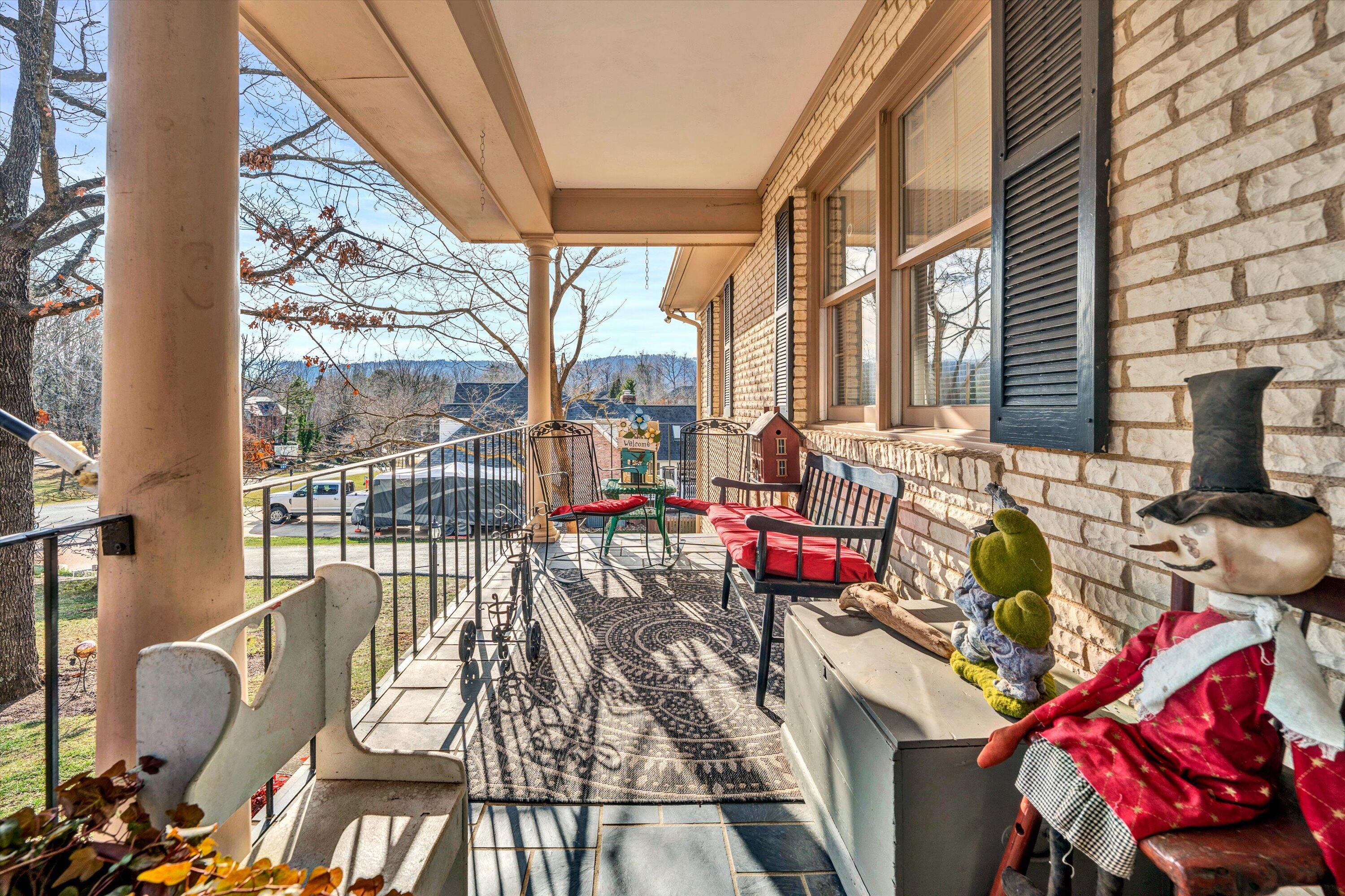 87 Queen Regent Court Blue Ridge, VA 24064 - Photo 4 of 38 a view of balcony with couch and chairs