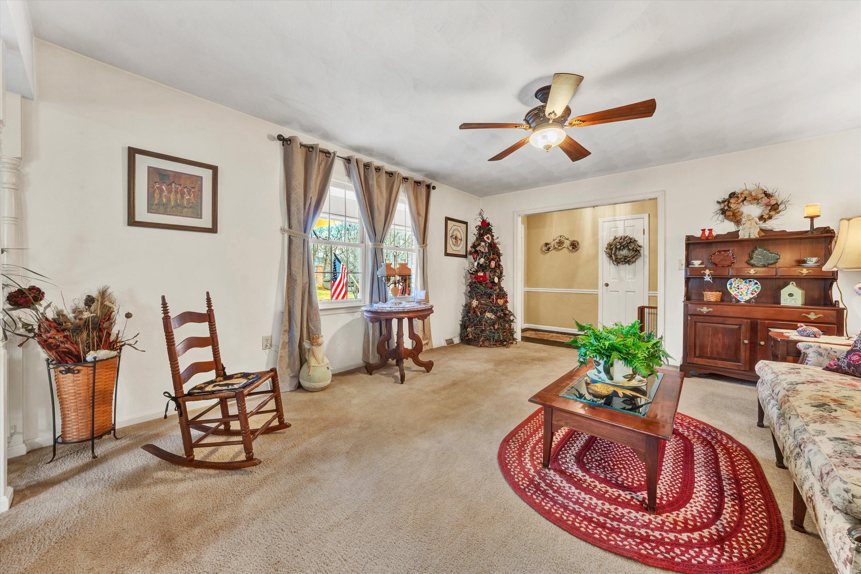 87 Queen Regent Court Blue Ridge, VA 24064 - Photo 8 of 38 a living room with furniture and a floor to ceiling window