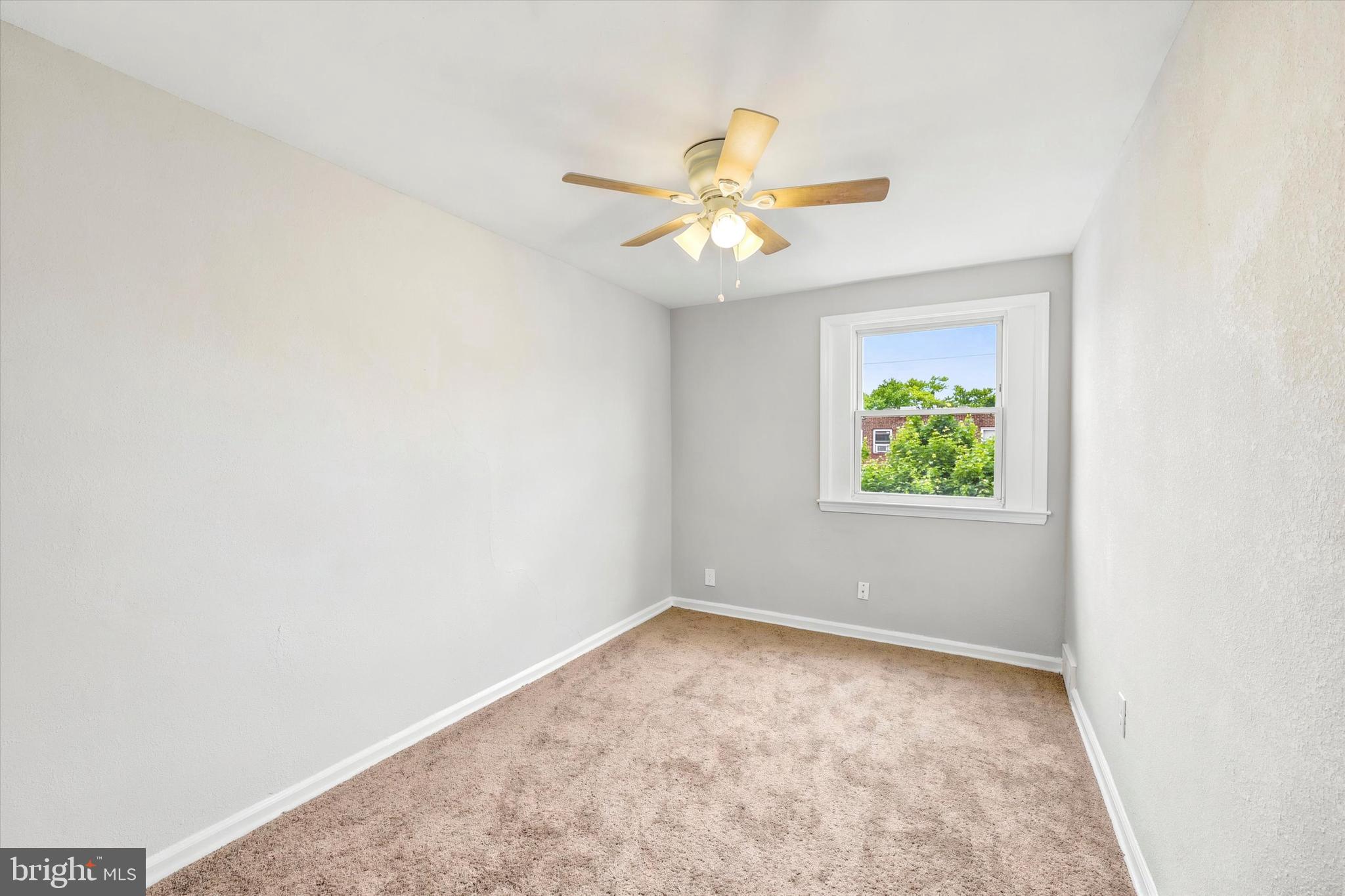 2052 Heather Road Folcroft, PA 19032 - Photo 12 of 17 an empty room with a window and a fan