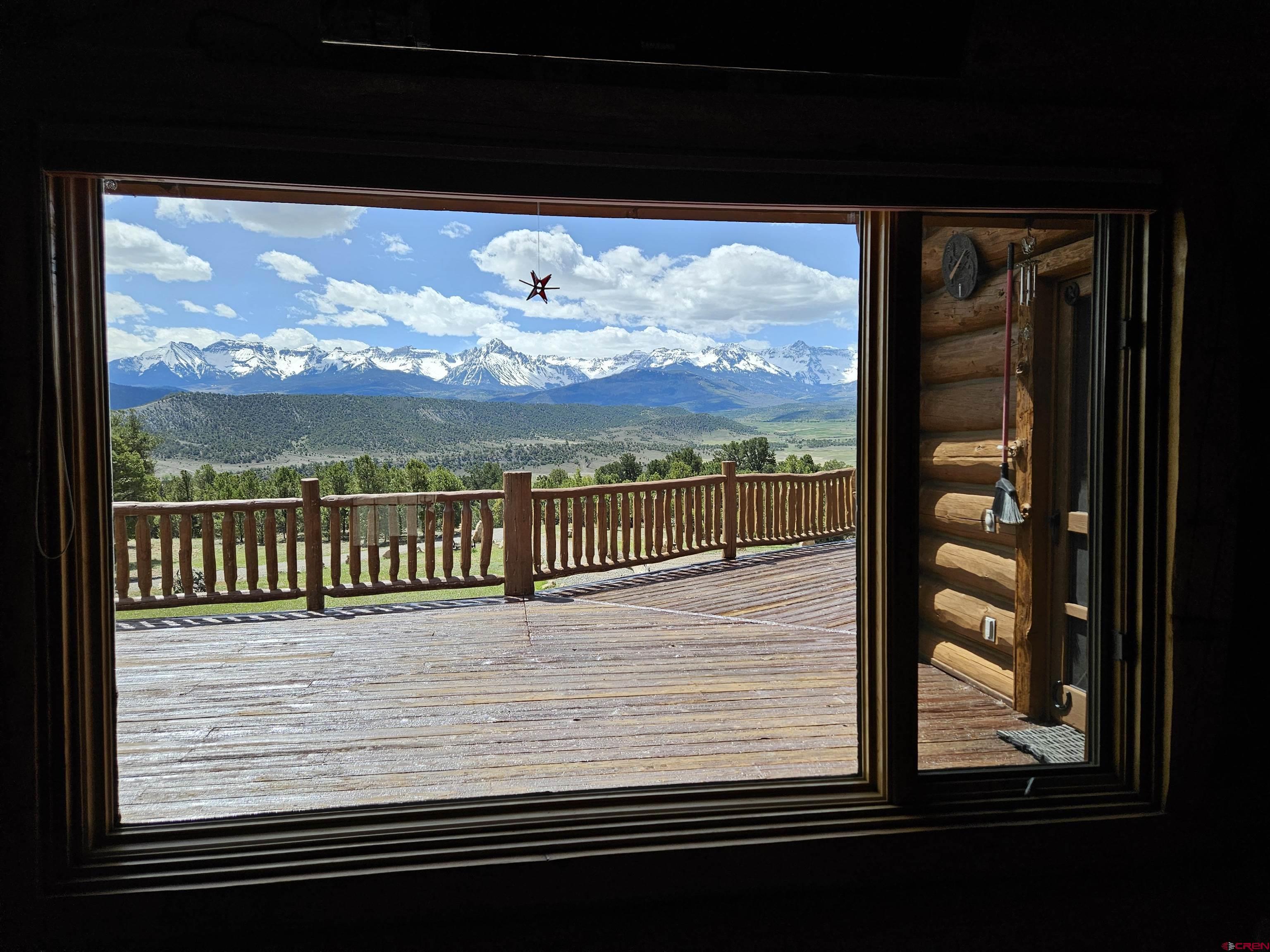 212 Pleasant Drive Ridgway, CO 81432 - Photo 18 of 35 a view of balcony and floor to ceiling windows with lake view