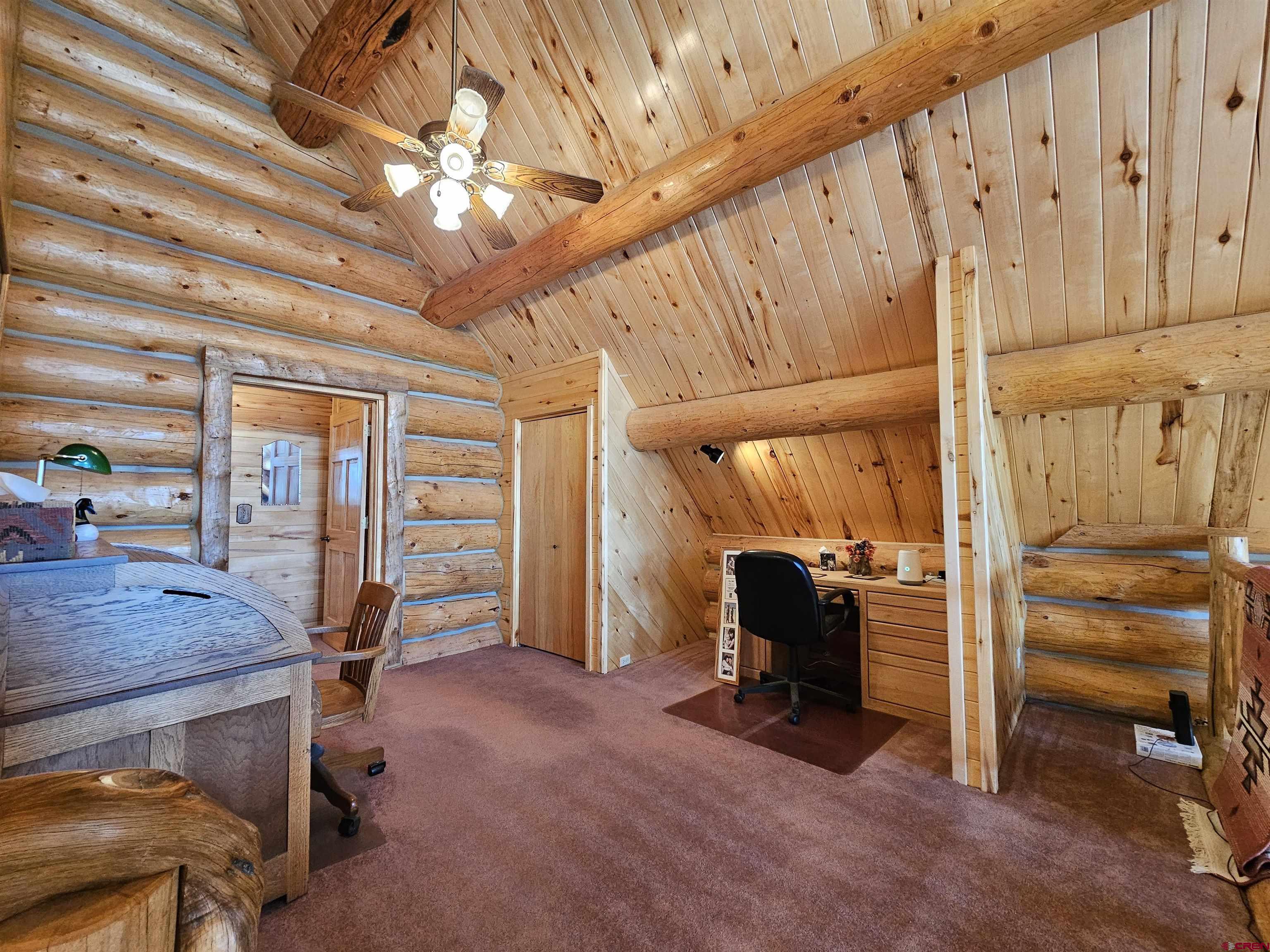 212 Pleasant Drive Ridgway, CO 81432 - Photo 26 of 35 a view of a room with lots of wooden furniture