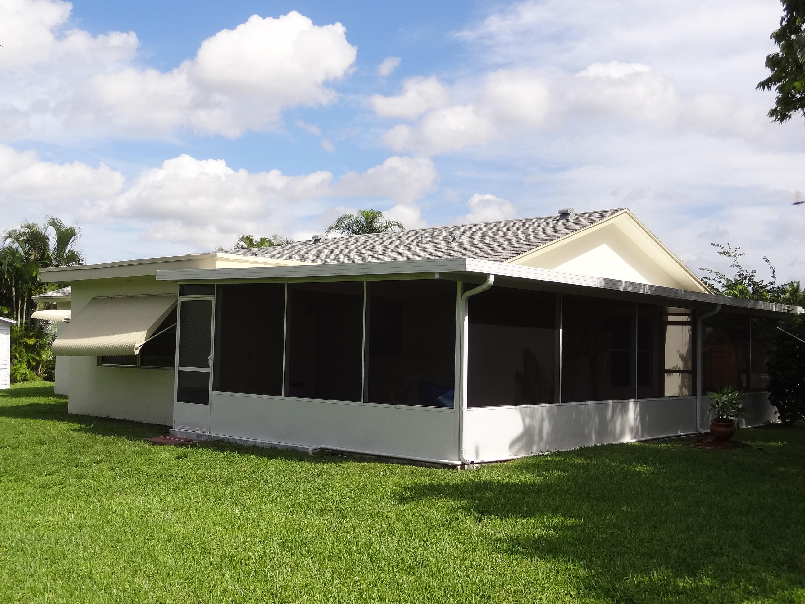 9805 Alaska Circle Boca Raton, FL 33434 - Photo 6 of 23 LARGE L SHAPED ROOFED AND SCREENED PATIO