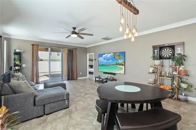 a view of a livingroom with furniture and a chandelier