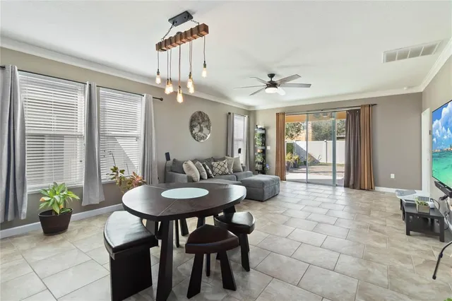 a kitchen with a dining table and chairs