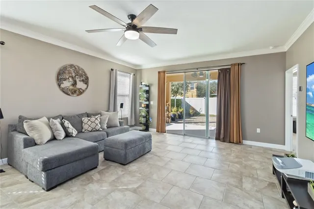 a living room with furniture and a large window