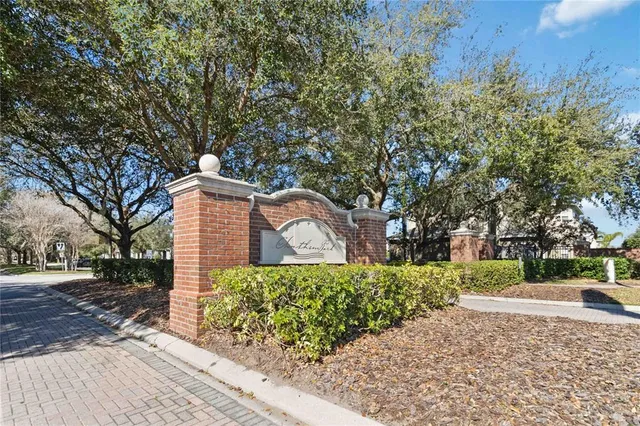 a view of a backyard with swimming pool