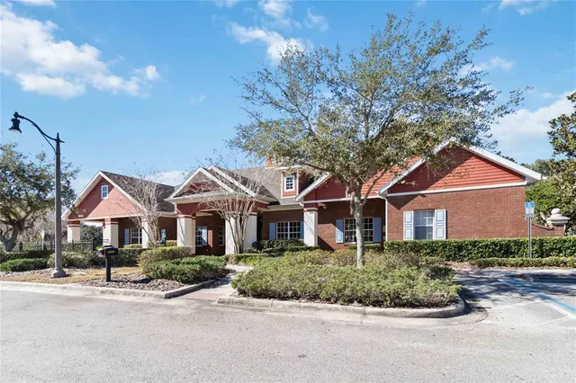 a view of a swimming pool with lounge chairs in patio
