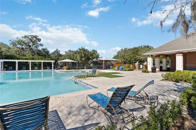 a view of a livingroom with furniture and a floor to ceiling window