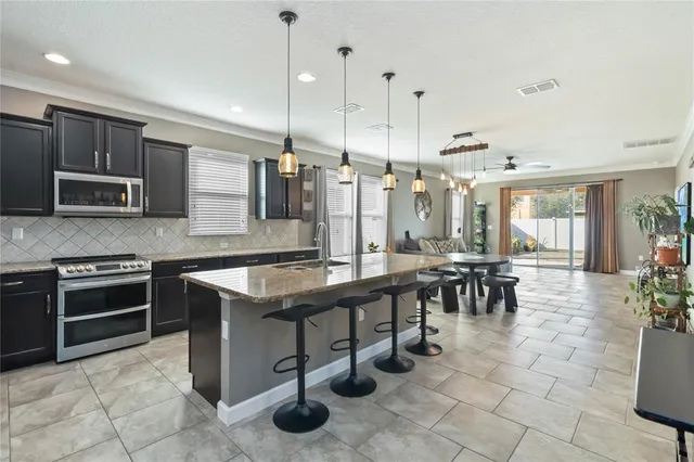 a kitchen with sink cabinets and window