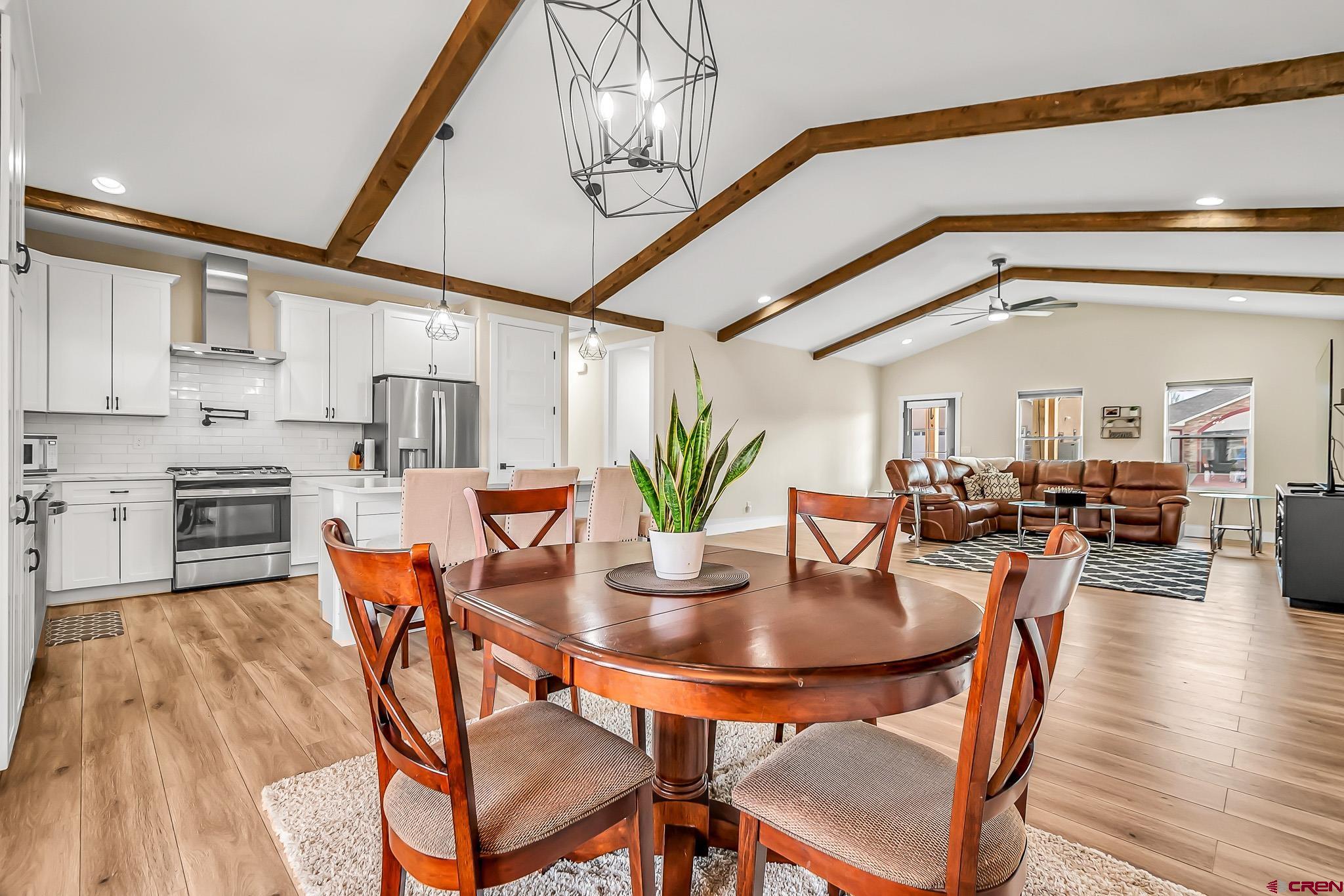 3337 Congress Street Montrose, CO 81401 - Photo 12 of 33 a dining room with furniture and wooden floor
