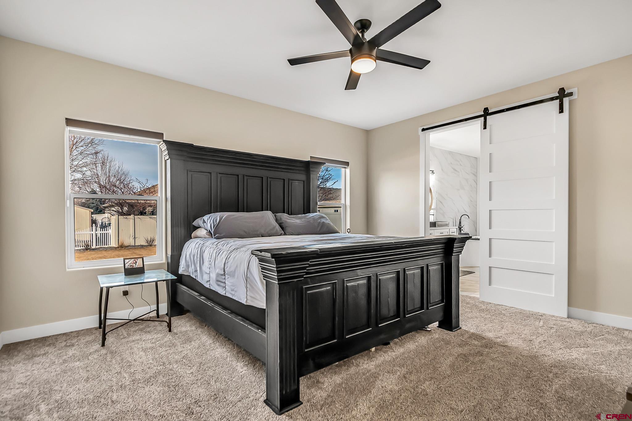 3337 Congress Street Montrose, CO 81401 - Photo 14 of 33 a bed room with a bed and a window