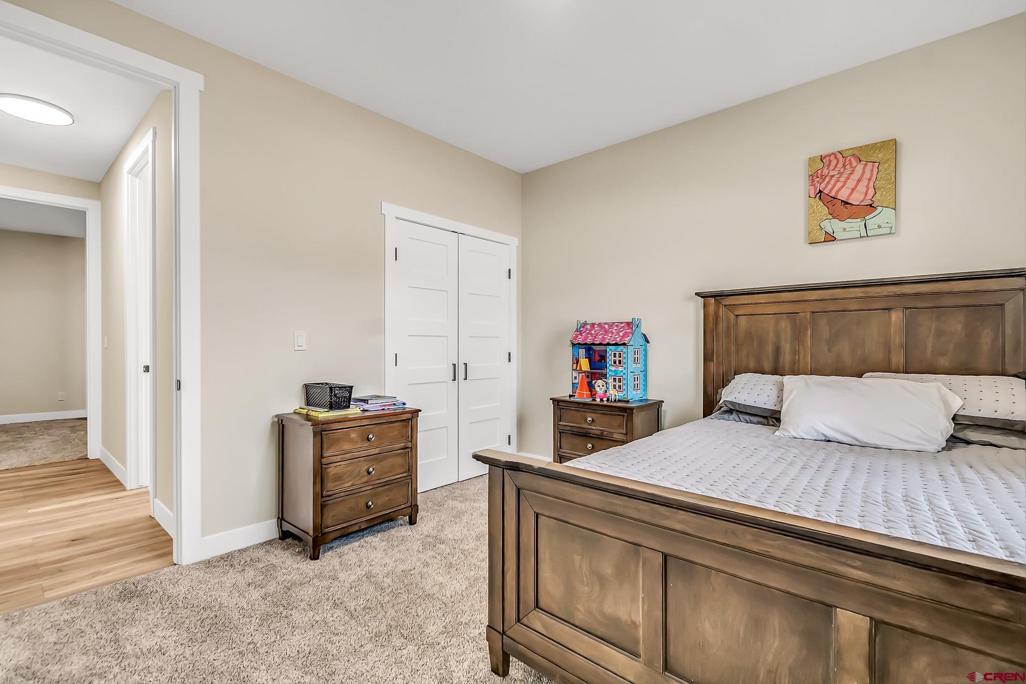 3337 Congress Street Montrose, CO 81401 - Photo 20 of 33 a bedroom with a bed and a couch