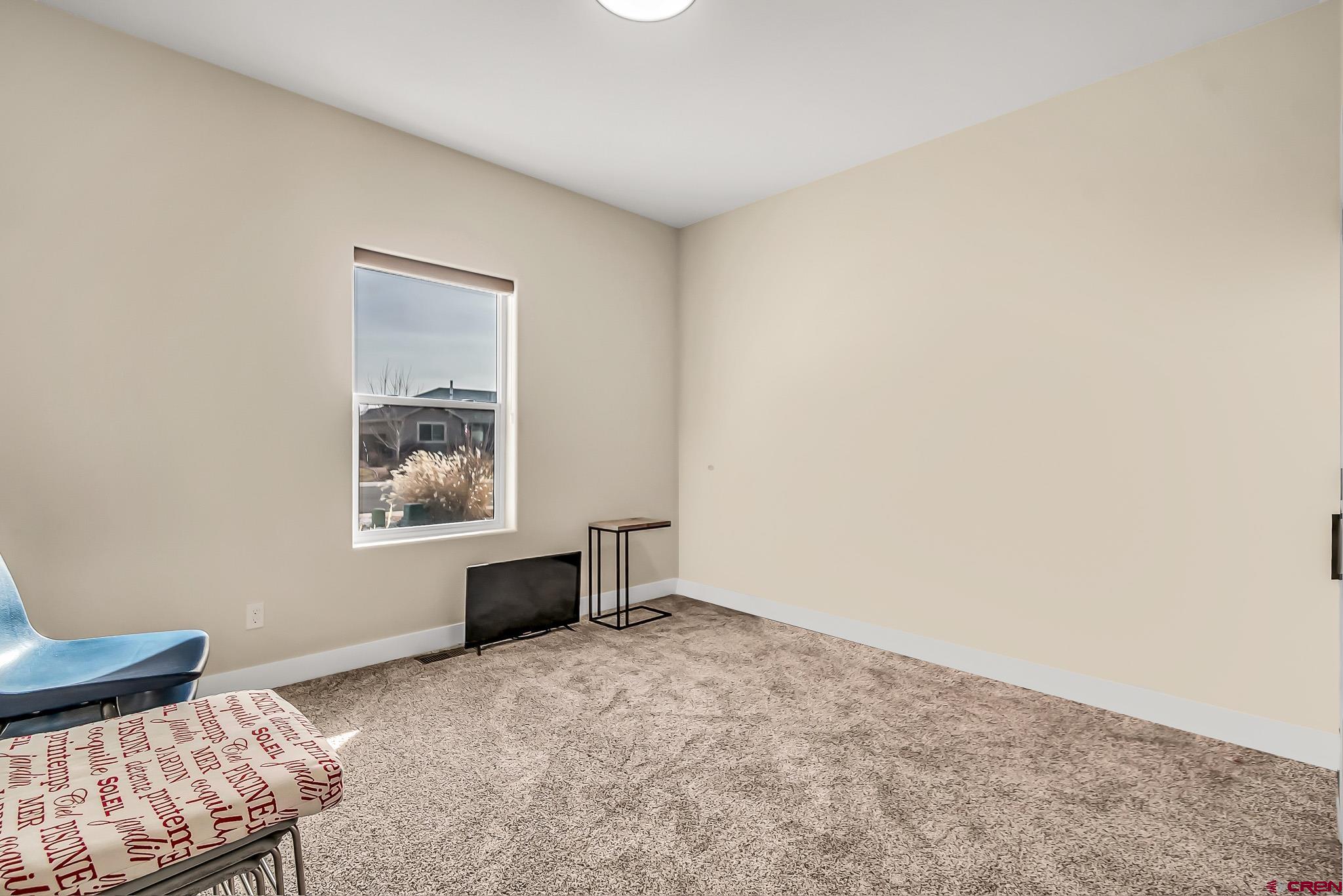 3337 Congress Street Montrose, CO 81401 - Photo 21 of 33 a bedroom with a bed and furniture