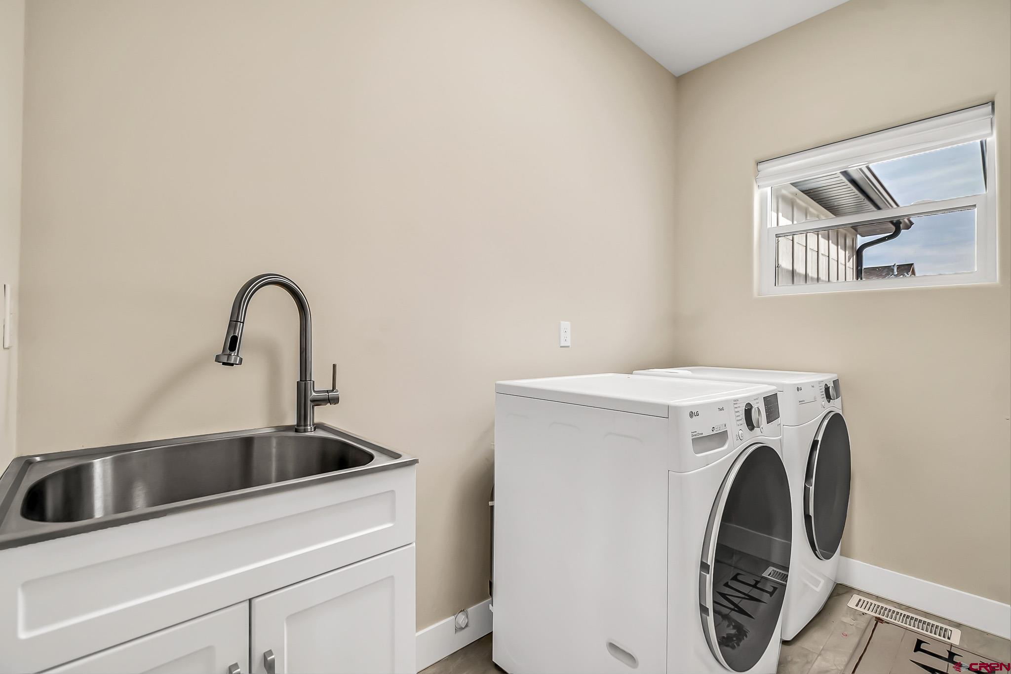 3337 Congress Street Montrose, CO 81401 - Photo 24 of 33 a utility room with dryer and washer