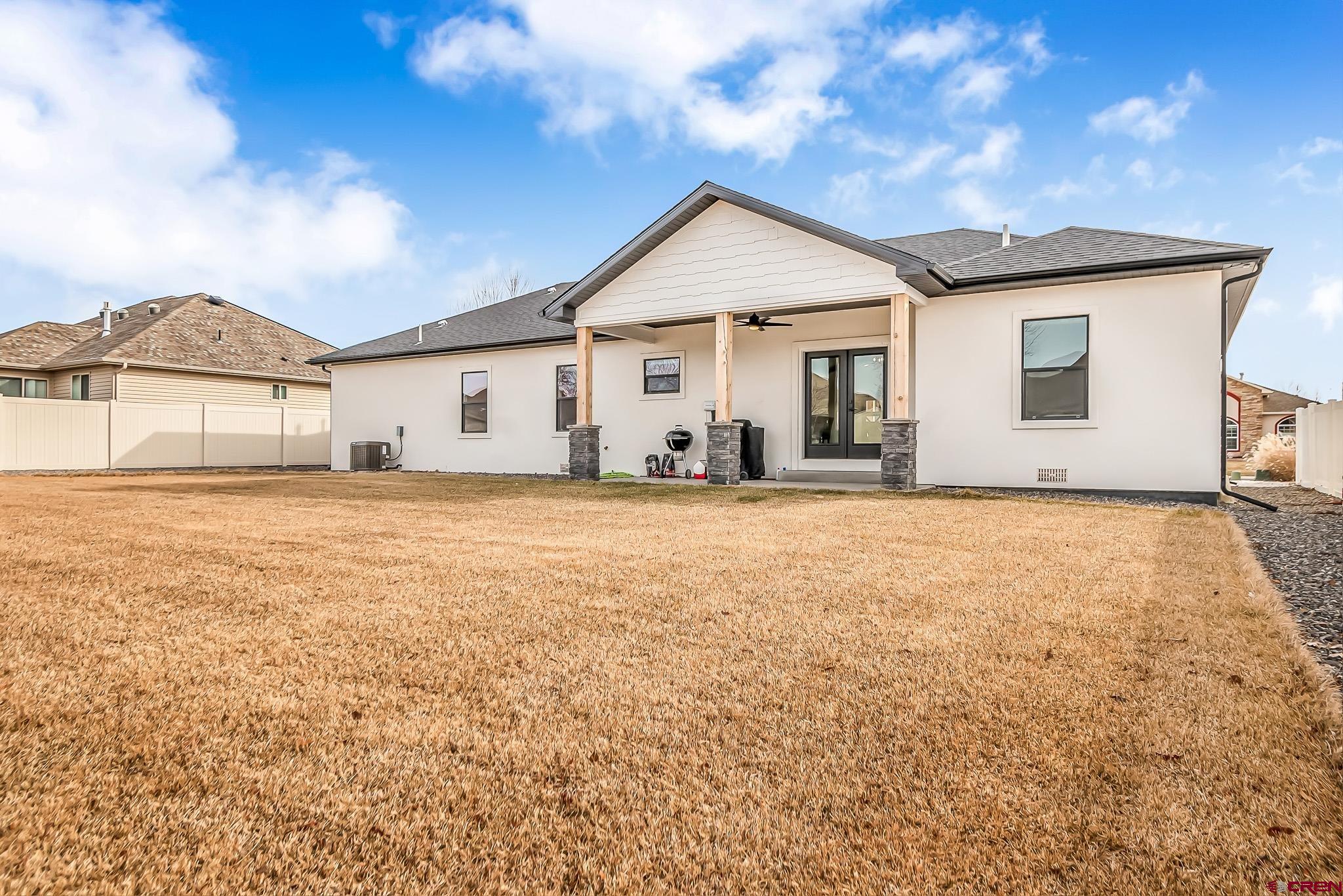 3337 Congress Street Montrose, CO 81401 - Photo 27 of 33 a front view of a house with a yard