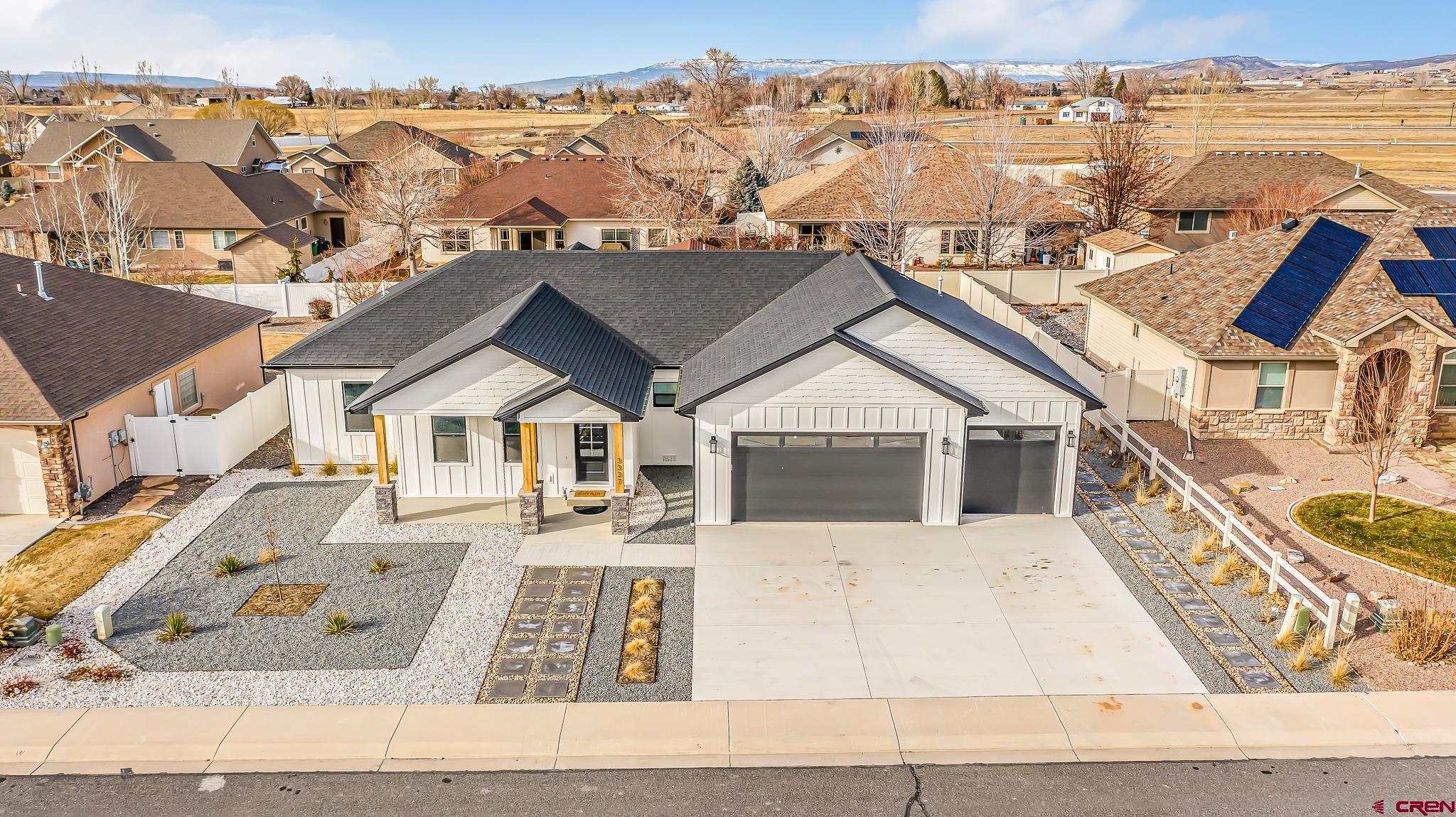 3337 Congress Street Montrose, CO 81401 - Photo 28 of 33 front view of a house with a wrought fence