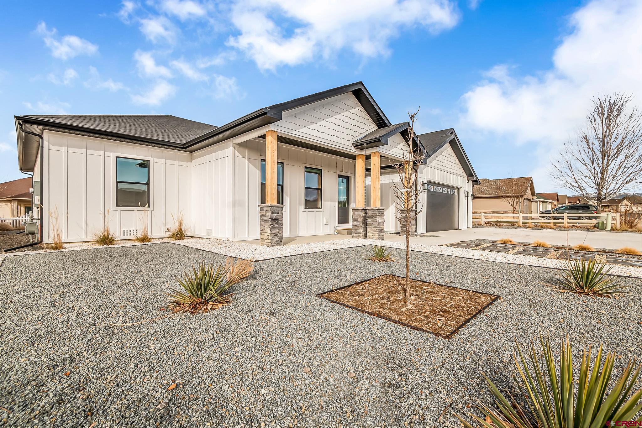 3337 Congress Street Montrose, CO 81401 - Photo 3 of 33 a front view of a house with a yard