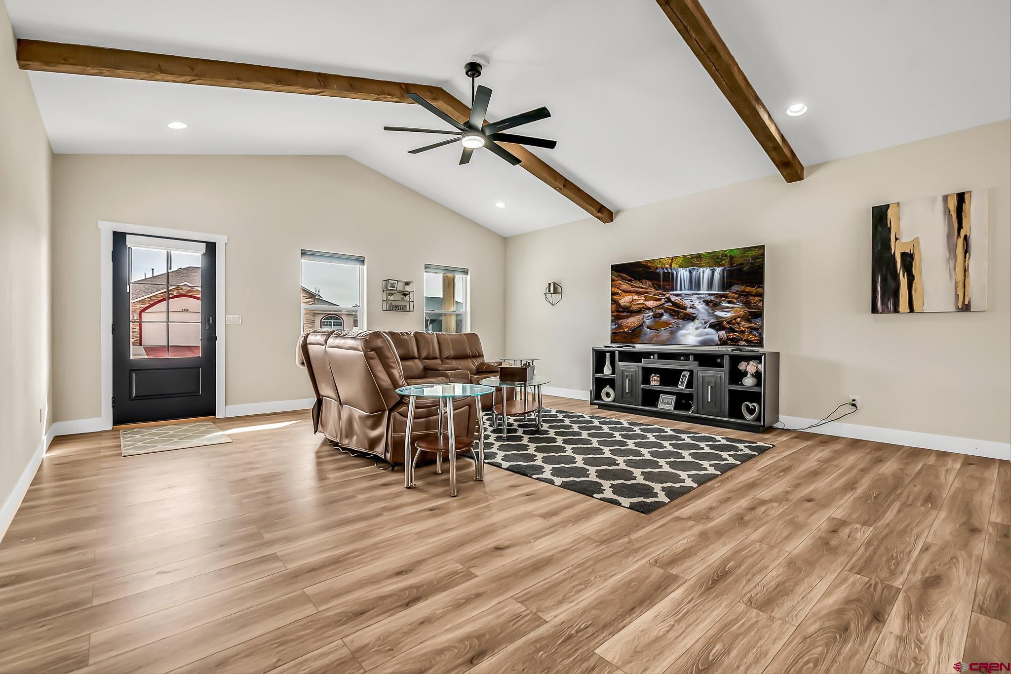 3337 Congress Street Montrose, CO 81401 - Photo 4 of 33 a living room with furniture and a flat screen tv