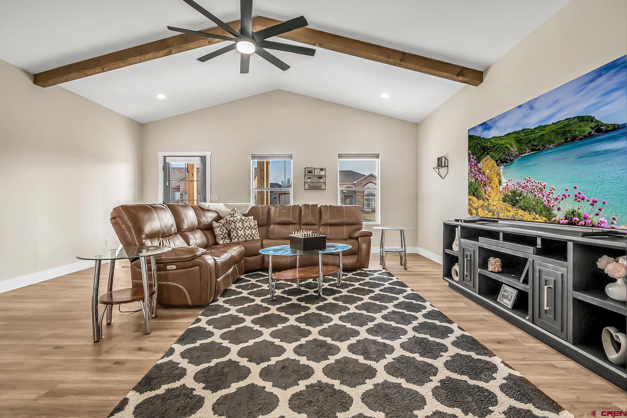 3337 Congress Street Montrose, CO 81401 - Photo 5 of 33 a living room with furniture and a flat screen tv