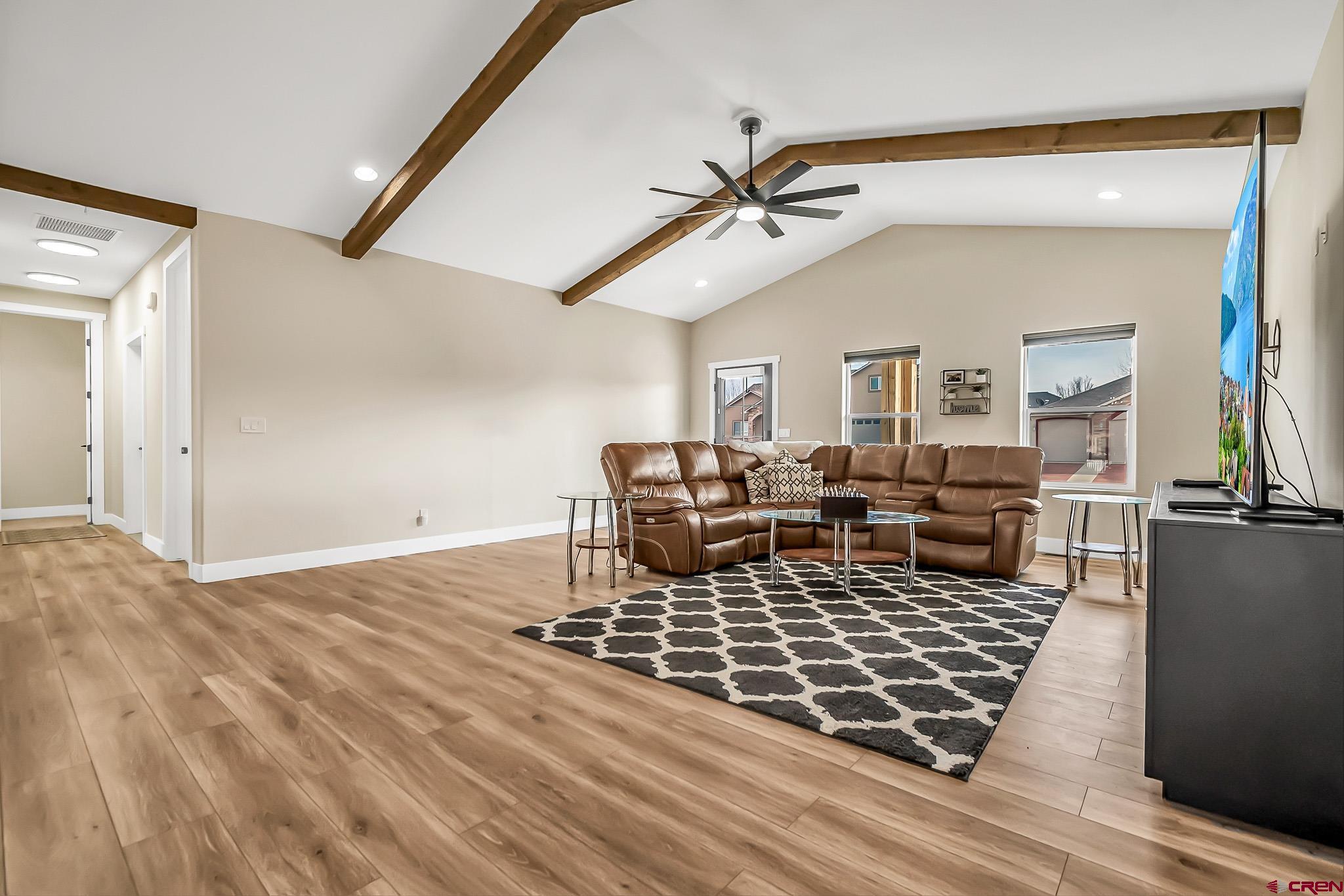 3337 Congress Street Montrose, CO 81401 - Photo 6 of 33 a living room with lots of furniture and a rug