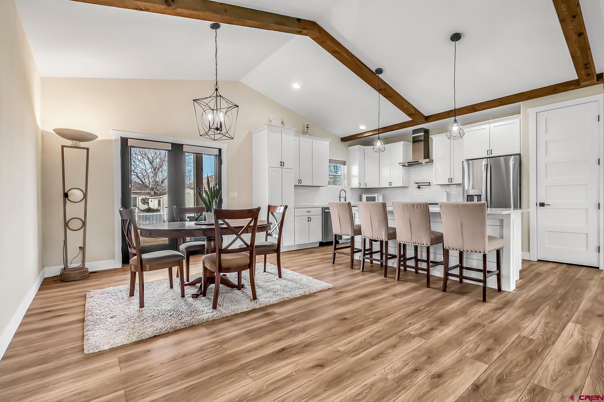 3337 Congress Street Montrose, CO 81401 - Photo 7 of 33 a view of a dining room with furniture and wooden floor