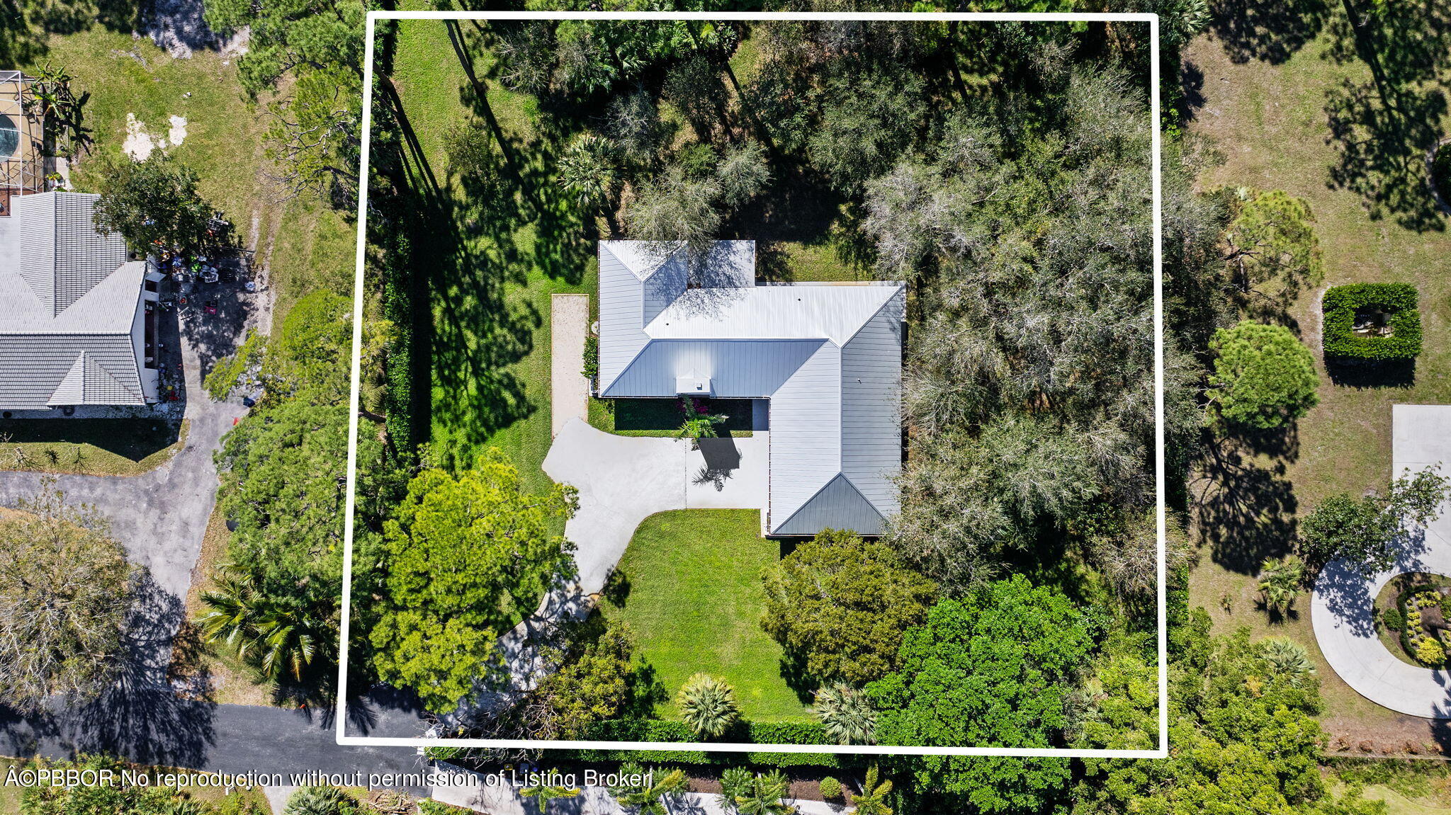 an aerial view of a house with a garden