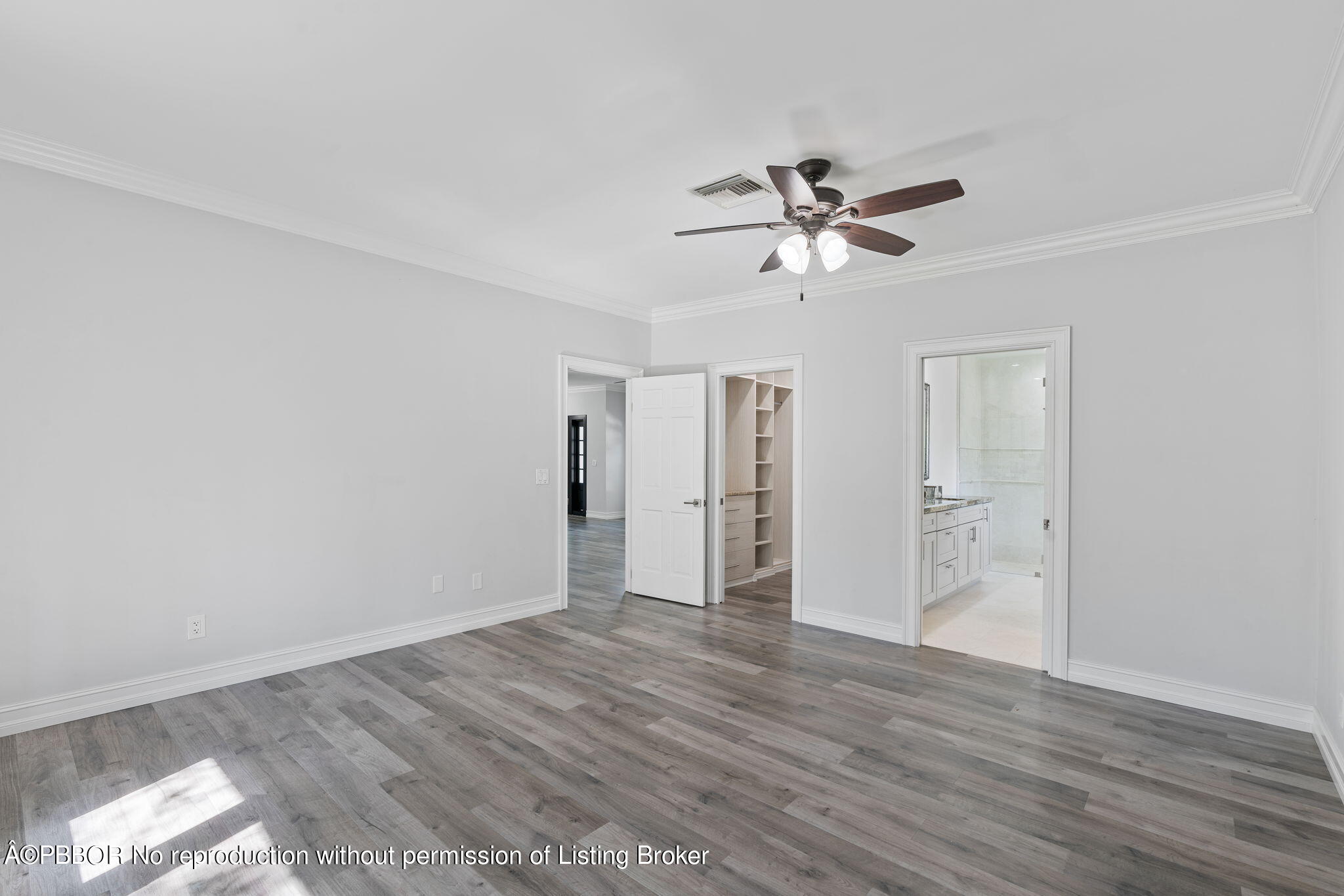 5608 Old Fort Jupiter Road Jupiter, FL 33458 - Photo 20 of 59 a view of a room with wooden floor and ceiling fan