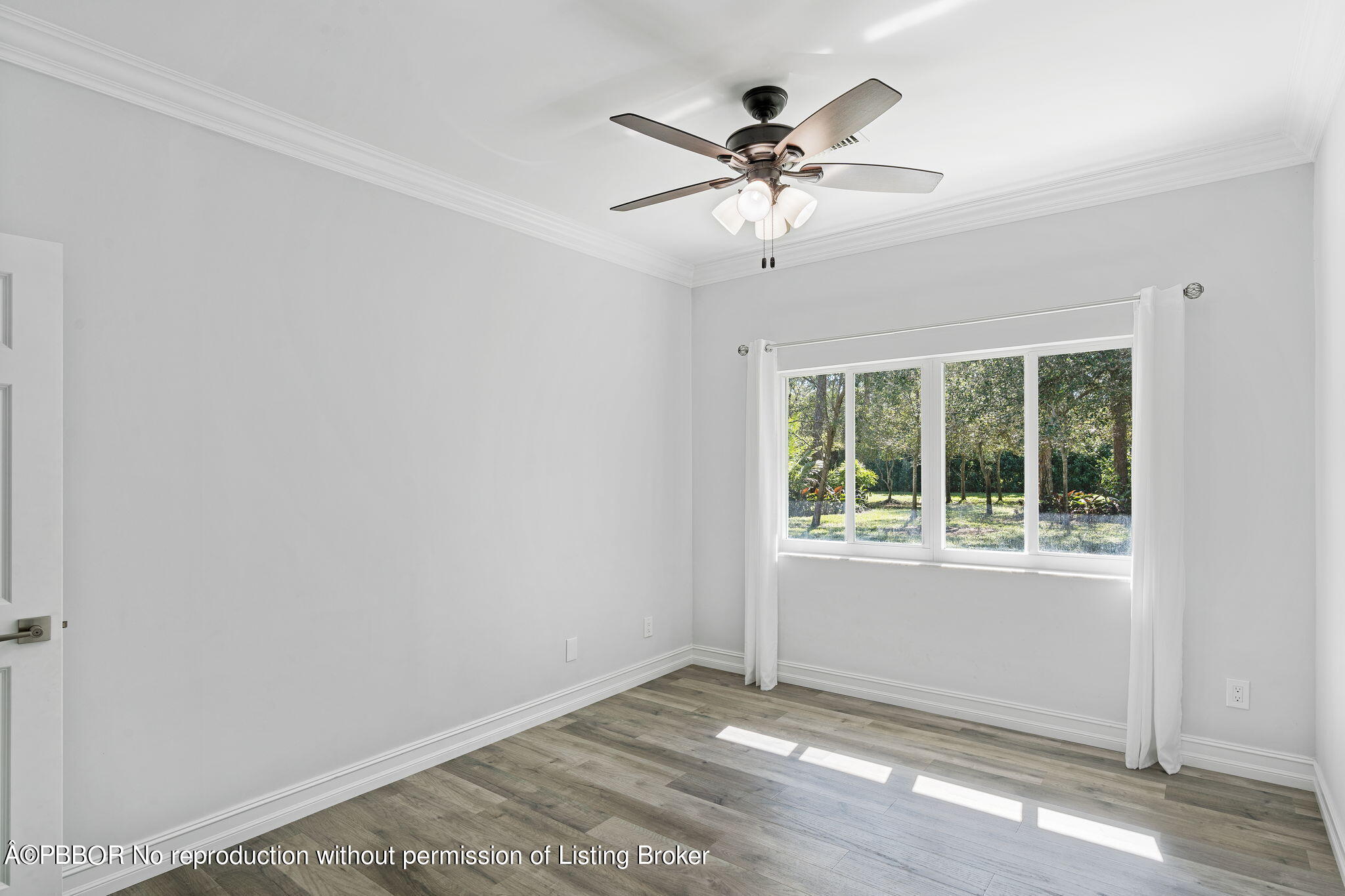 5608 Old Fort Jupiter Road Jupiter, FL 33458 - Photo 22 of 59 a view of a big room with wooden floor closet and windows