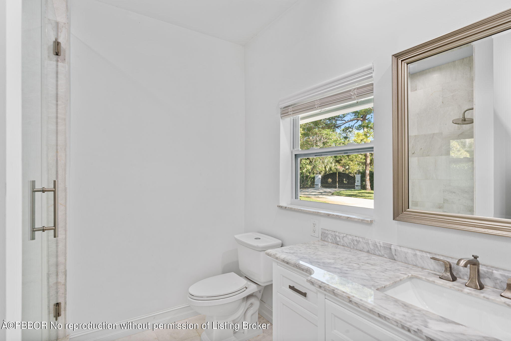 5608 Old Fort Jupiter Road Jupiter, FL 33458 - Photo 23 of 59 a bathroom with a granite countertop sink a toilet and a window