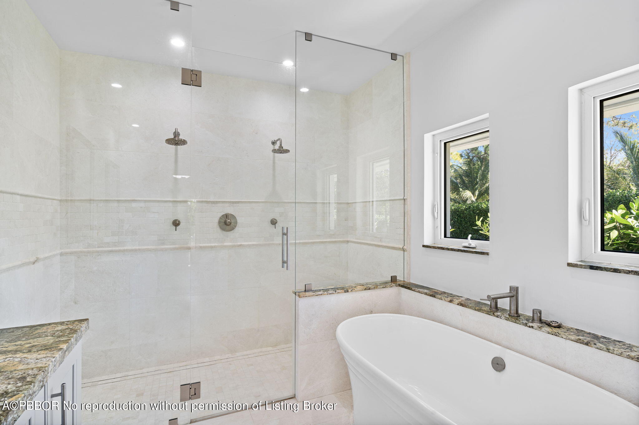 5608 Old Fort Jupiter Road Jupiter, FL 33458 - Photo 31 of 59 a bathroom with a tub sink and mirror