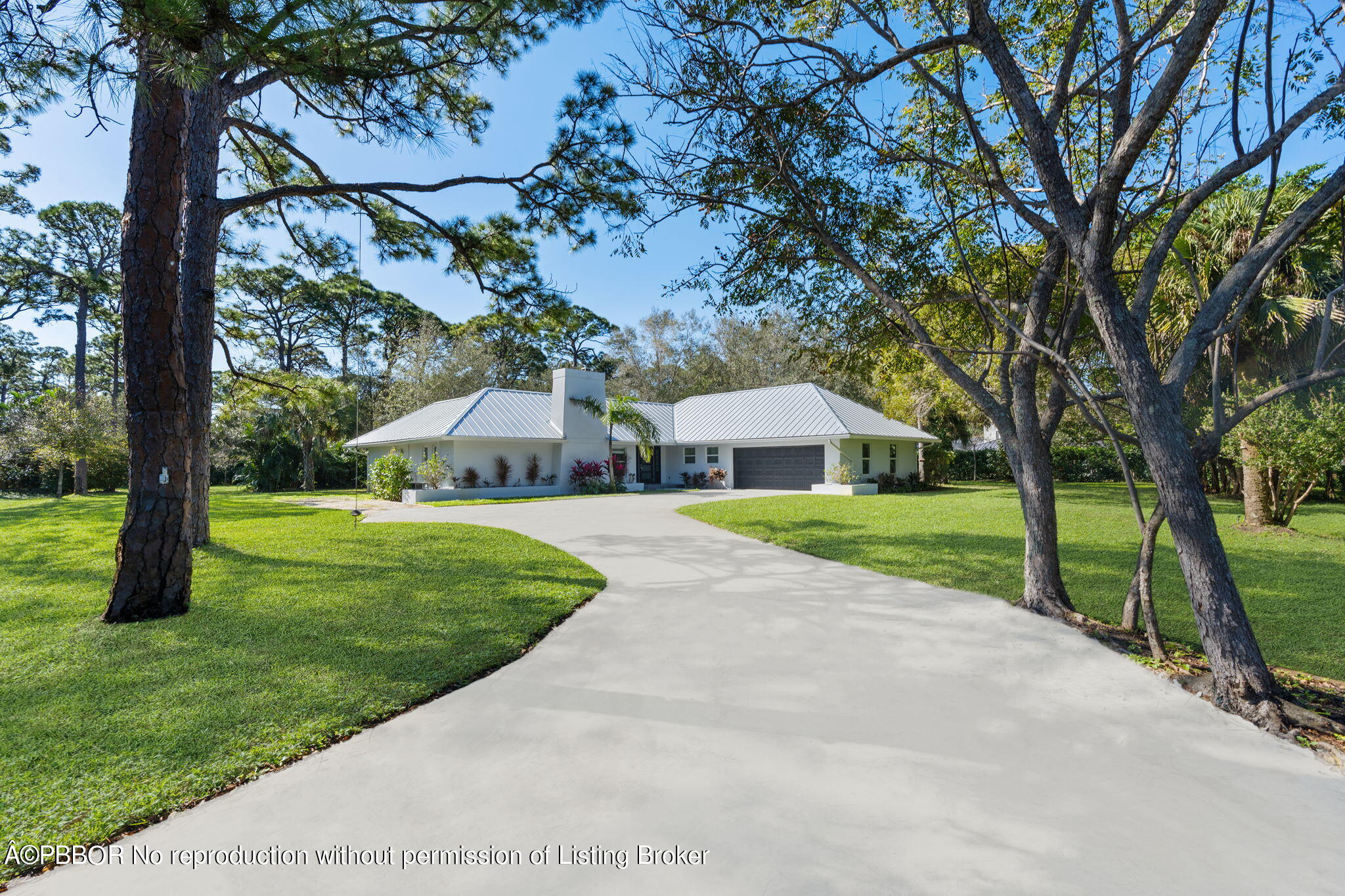 5608 Old Fort Jupiter Road Jupiter, FL 33458 - Photo 37 of 59 a front view of a house with yard and green space