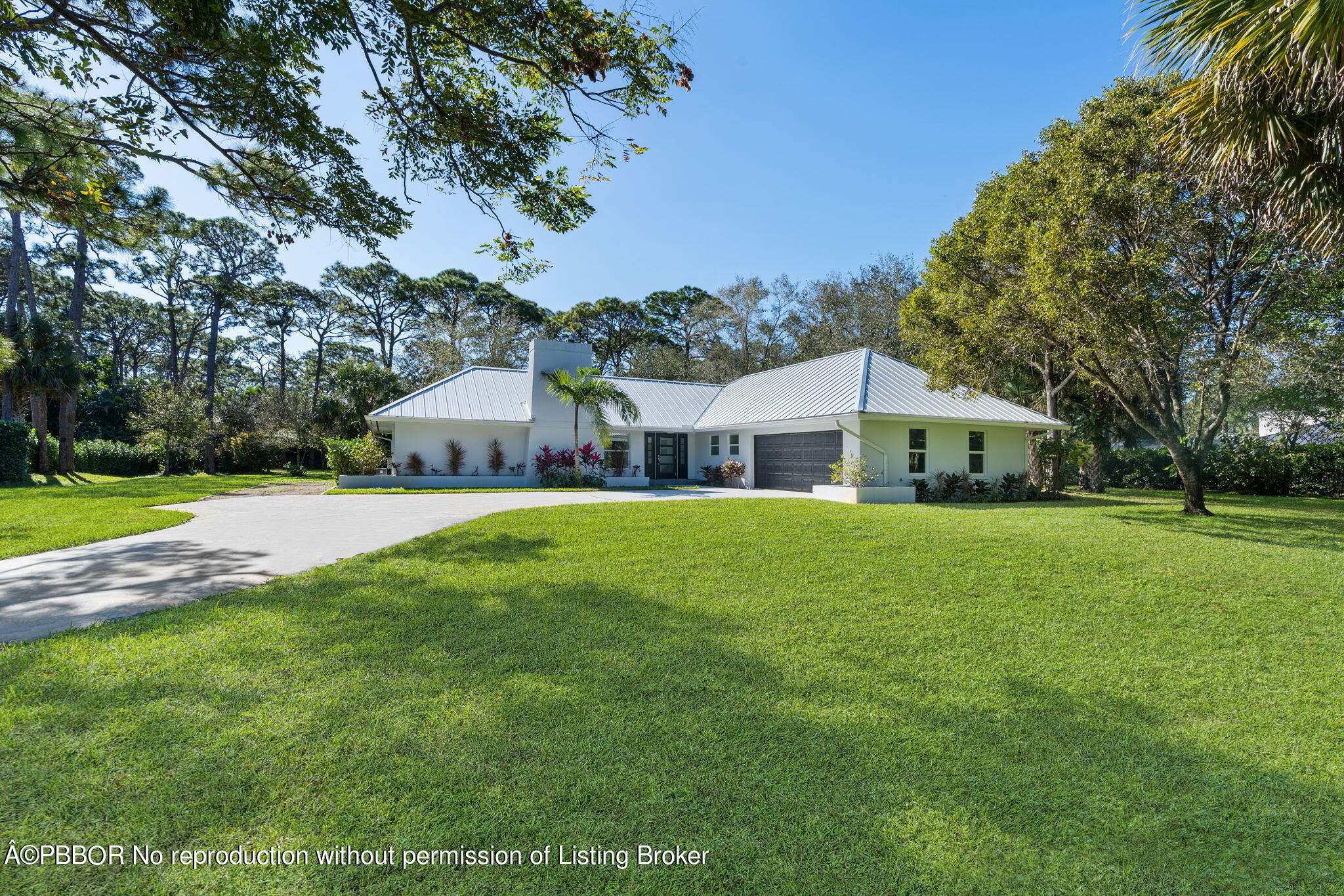 5608 Old Fort Jupiter Road Jupiter, FL 33458 - Photo 38 of 59 a front view of a house with yard and green space