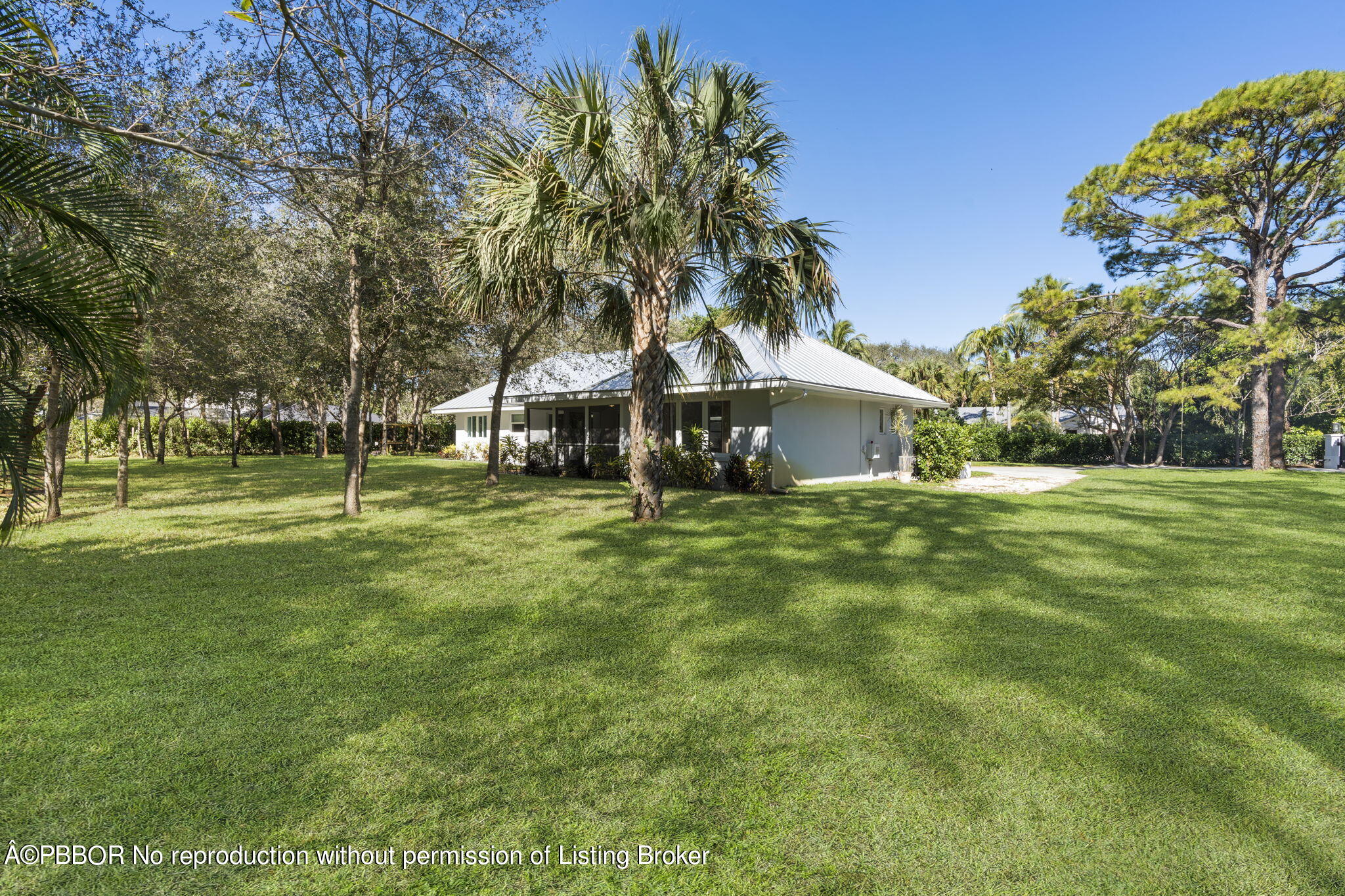 5608 Old Fort Jupiter Road Jupiter, FL 33458 - Photo 43 of 59 a front view of a house with a yard