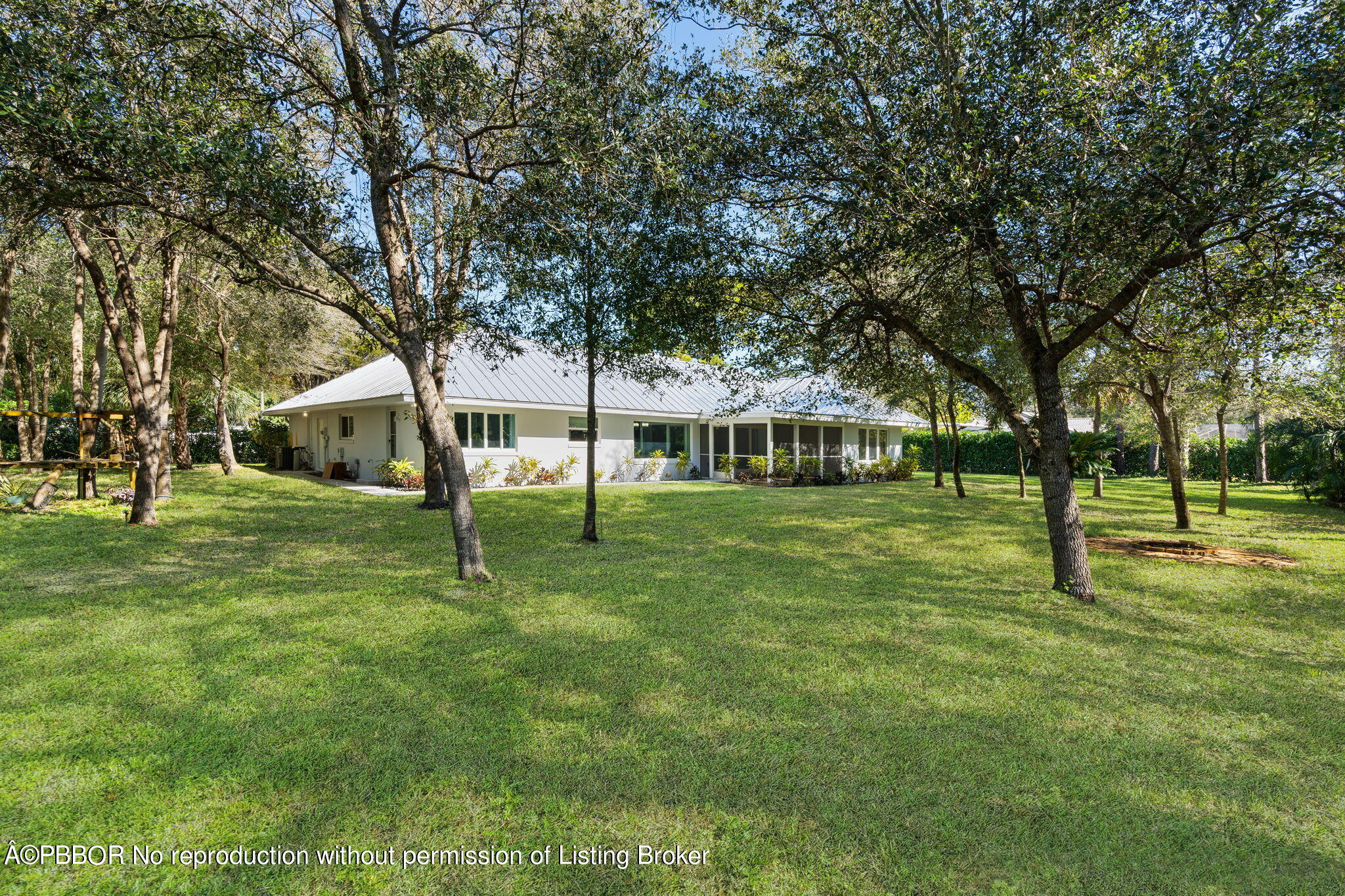 5608 Old Fort Jupiter Road Jupiter, FL 33458 - Photo 45 of 59 a view of a house with a backyard