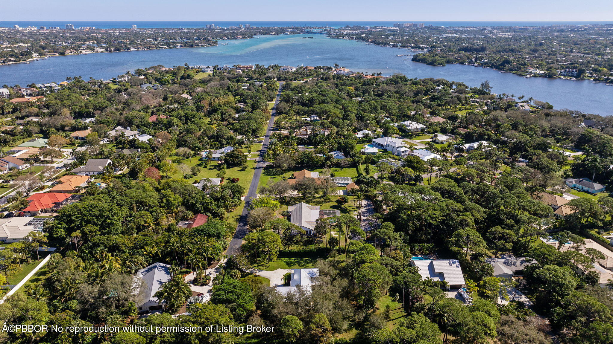 5608 Old Fort Jupiter Road Jupiter, FL 33458 - Photo 56 of 59 an aerial view of a houses with a lush green hillside