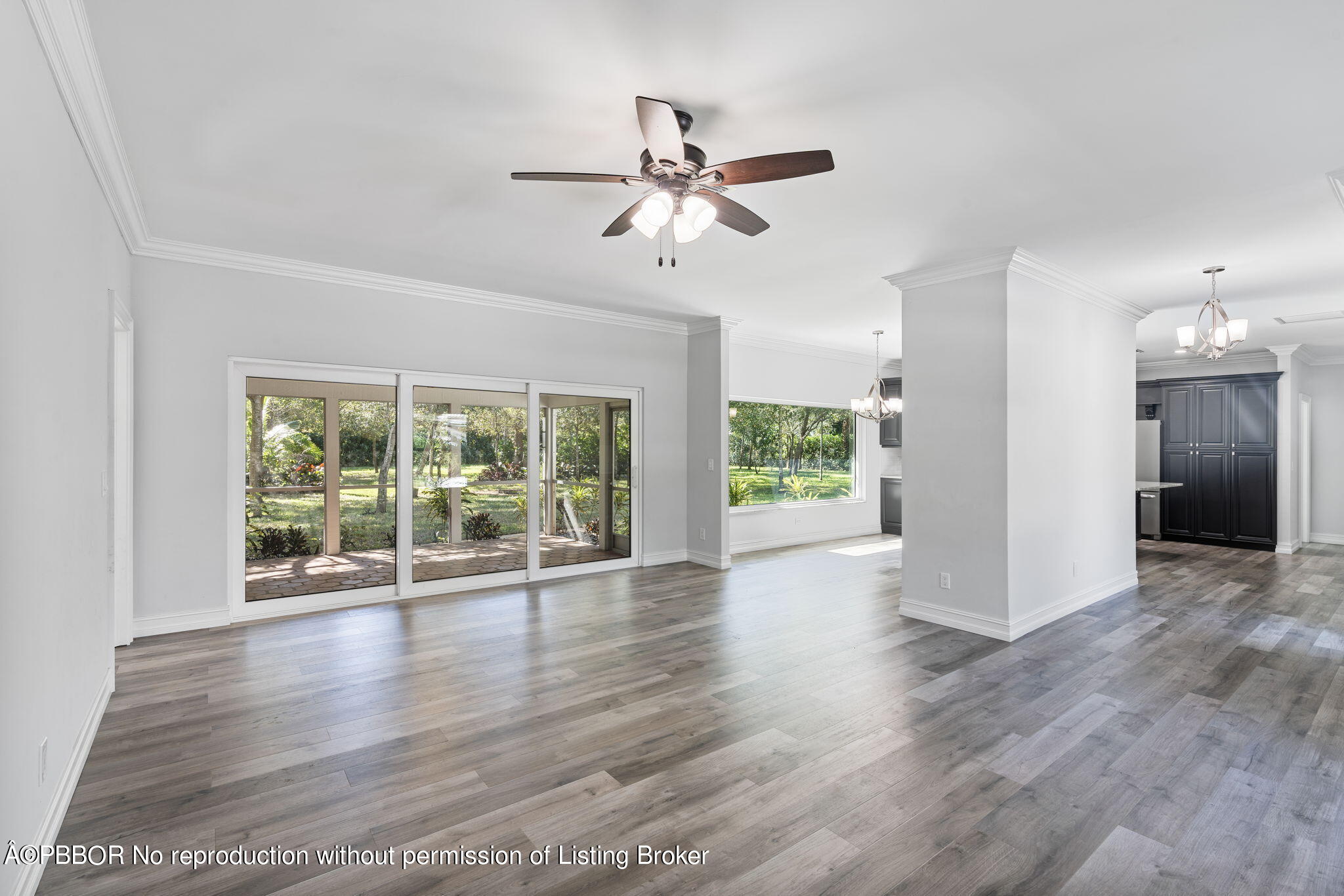 5608 Old Fort Jupiter Road Jupiter, FL 33458 - Photo 6 of 59 a view of empty room with wooden floor and fan
