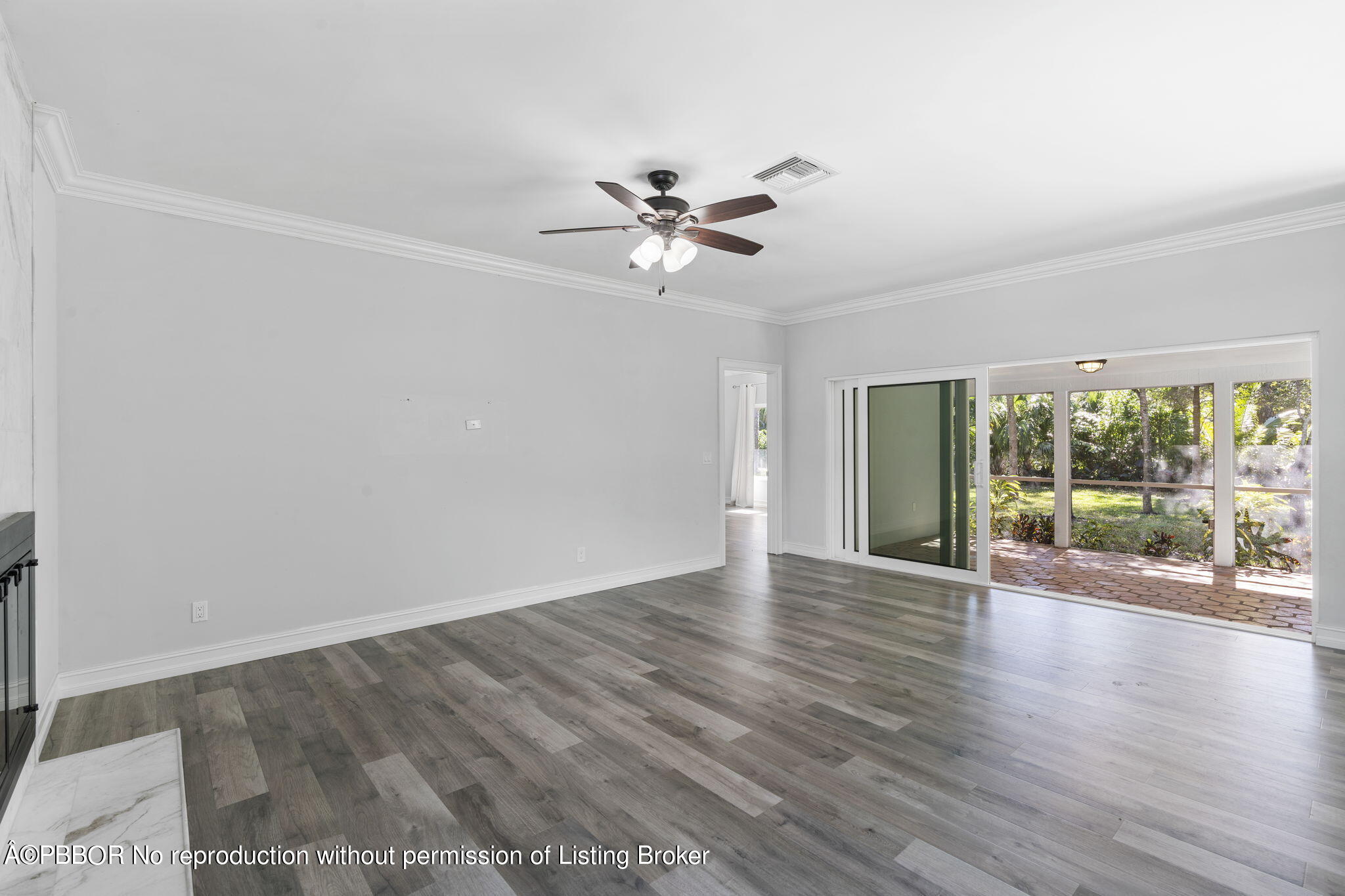 5608 Old Fort Jupiter Road Jupiter, FL 33458 - Photo 9 of 59 wooden floor in an empty room with a window