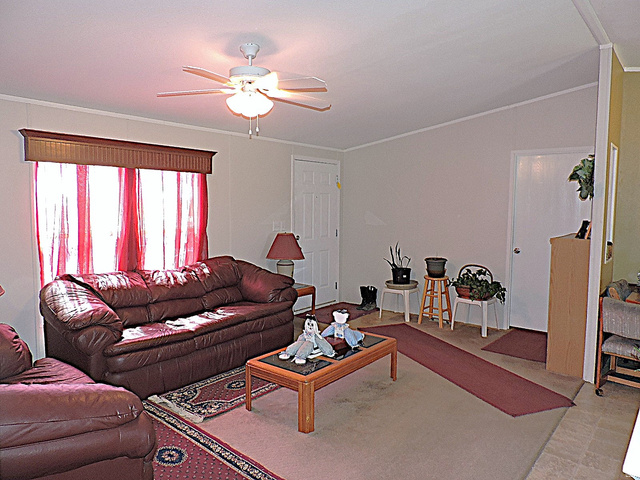 915 North 5000 W Road Hinckley, UT 84635 - Photo 6 of 27 Living area with a ceiling fan light fixture, light wall tones,