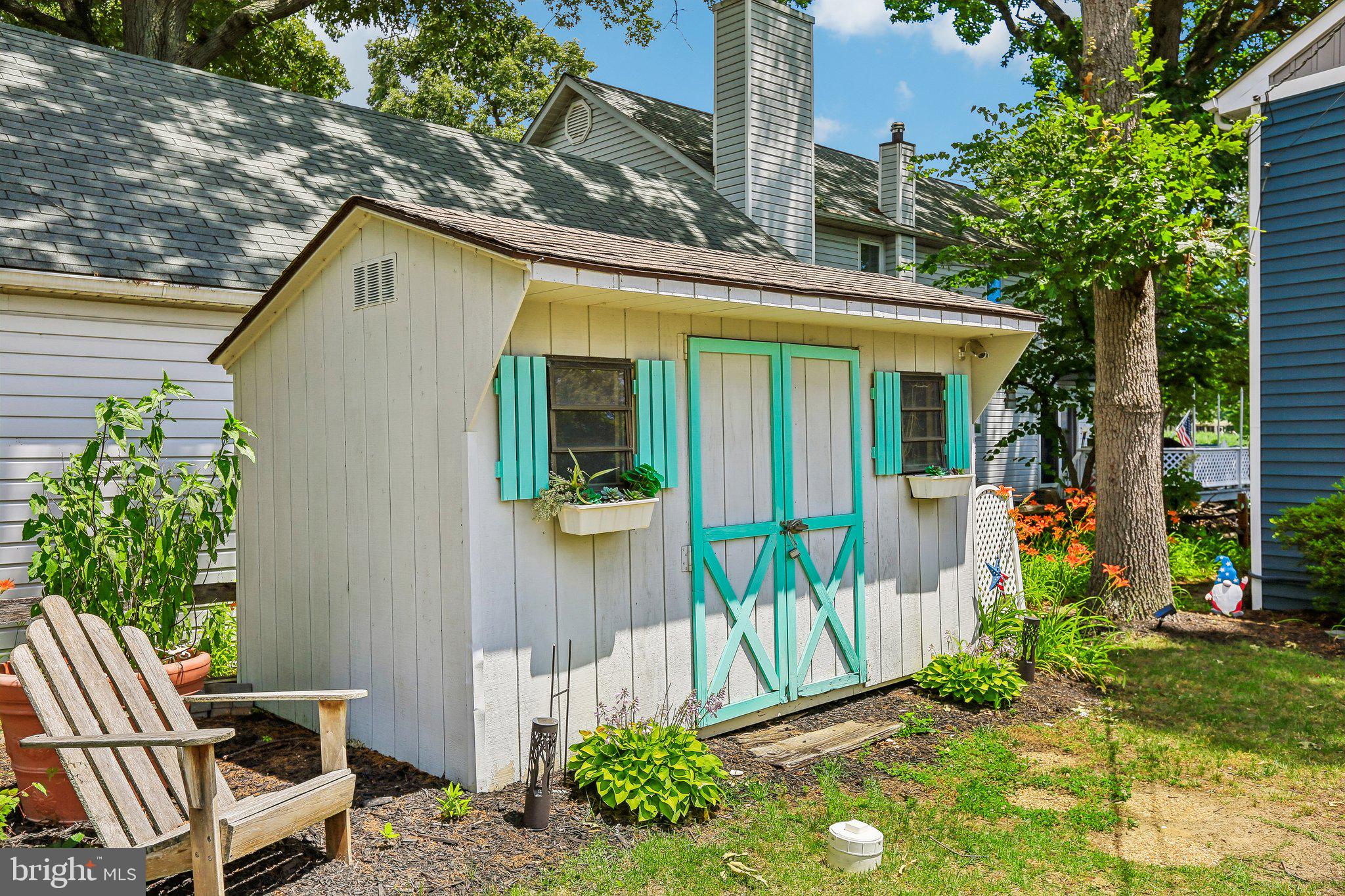 275 Gibson Road Pasadena, MD 21122 - Photo 27 of 59 Charming garden shed with vibrant accents.