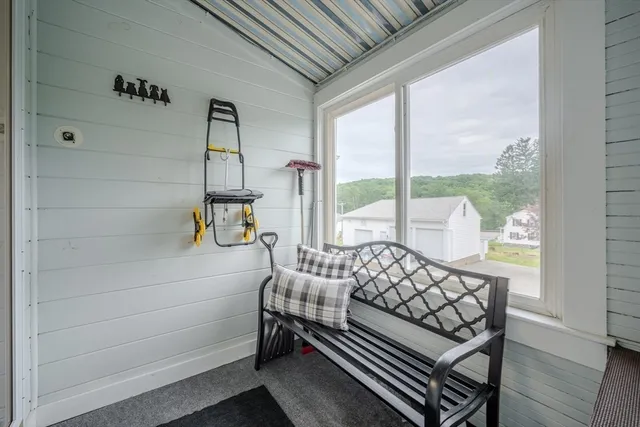 a bedroom with furniture and window