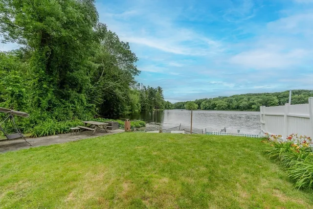 a view of a backyard with a small cabin