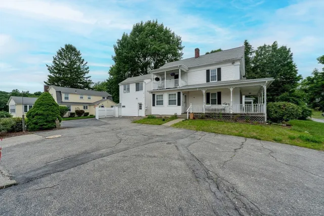 a house that has a tree in front of it