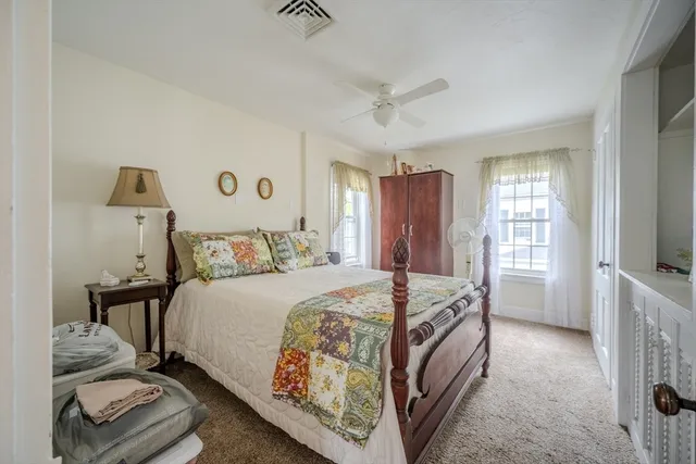 a bed room with a bed and a tv