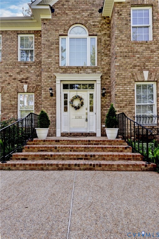 11385 Winding River Road Providence Forge, VA 23140 - Photo 10 of 43 a front view of a house with a yard