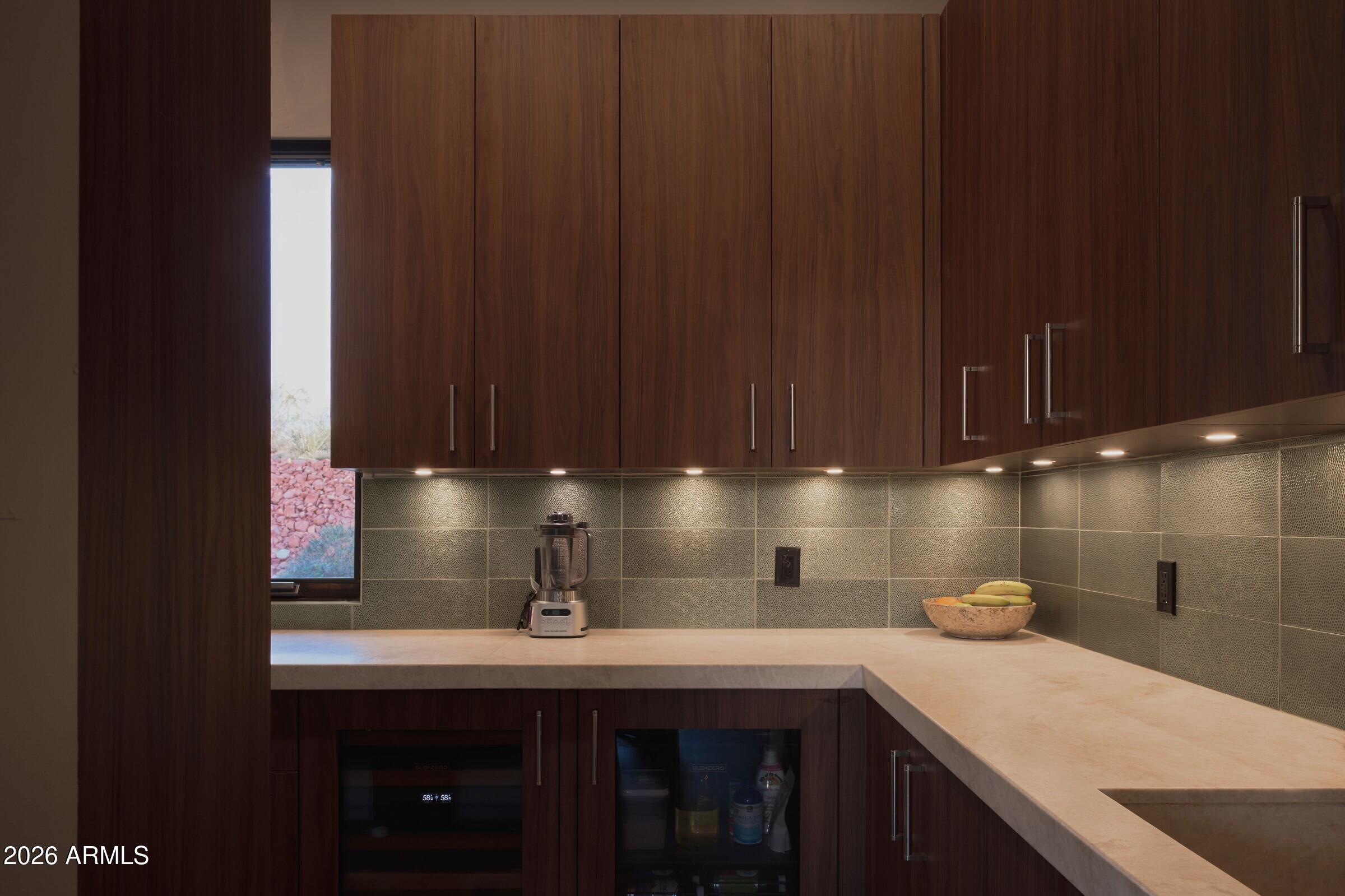 2925 Red Hawk Lane Sedona, AZ 86336 - Photo 12 of 35 a kitchen with a sink cabinets and has wooden floor