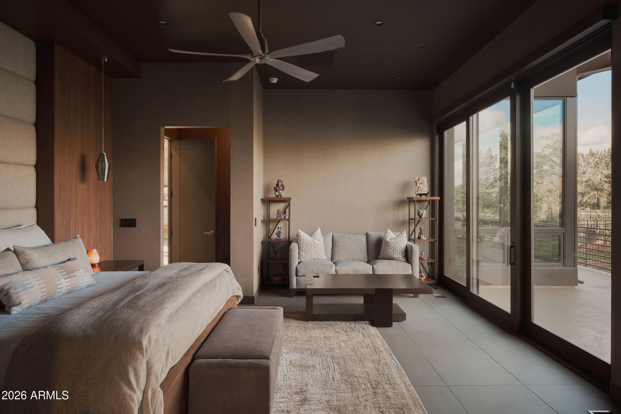 2925 Red Hawk Lane Sedona, AZ 86336 - Photo 16 of 35 a bedroom with furniture and large window