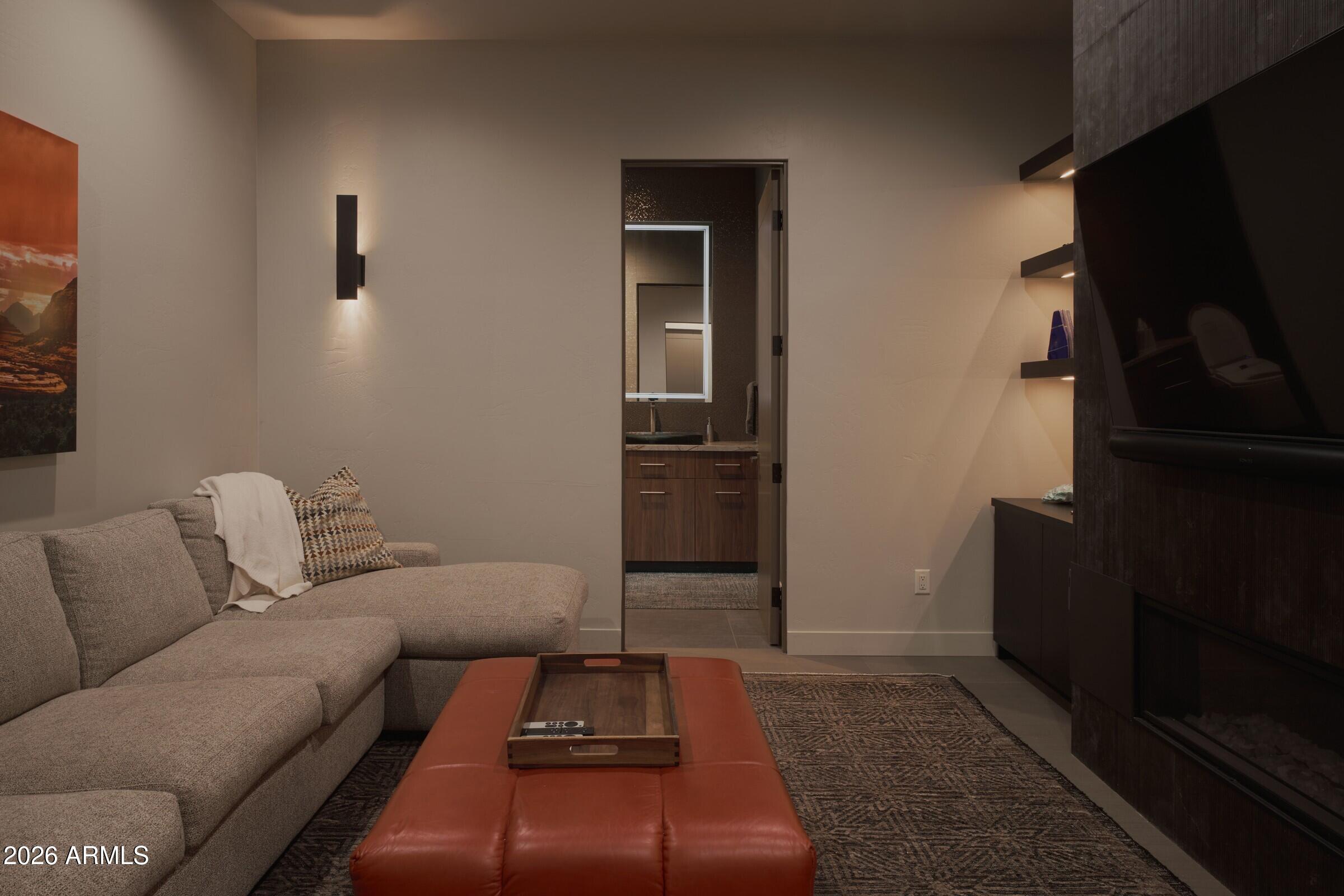 2925 Red Hawk Lane Sedona, AZ 86336 - Photo 23 of 35 a living room with furniture and a flat screen tv