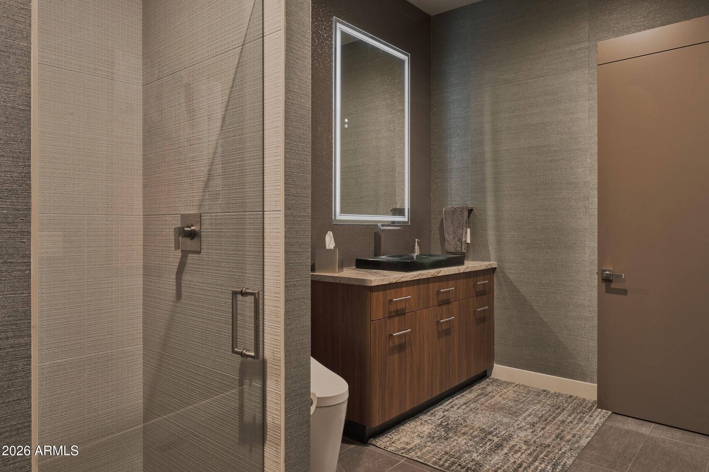 2925 Red Hawk Lane Sedona, AZ 86336 - Photo 24 of 35 a bathroom with a granite countertop sink and a mirror