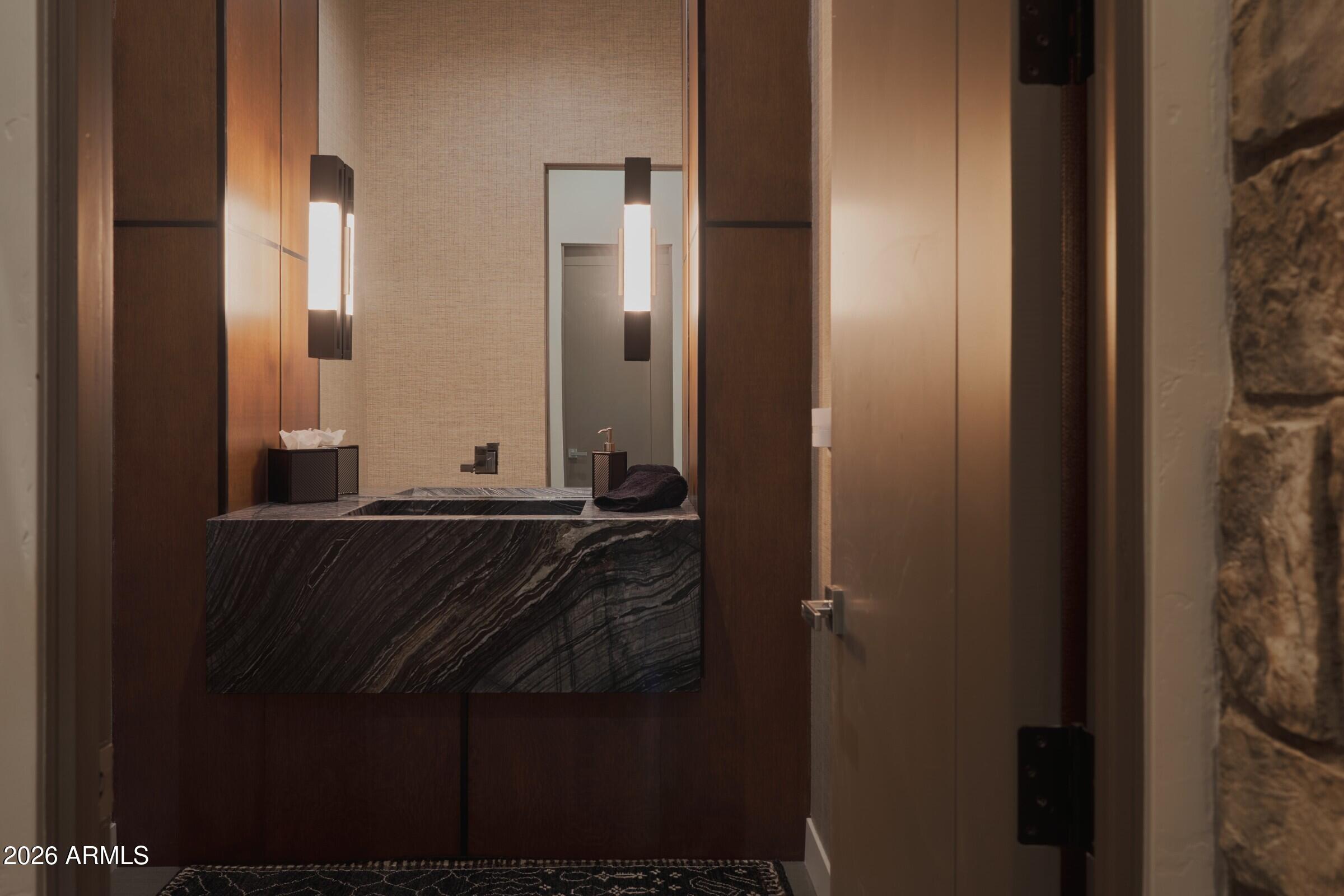 2925 Red Hawk Lane Sedona, AZ 86336 - Photo 26 of 35 a bathroom with a sink and a mirror