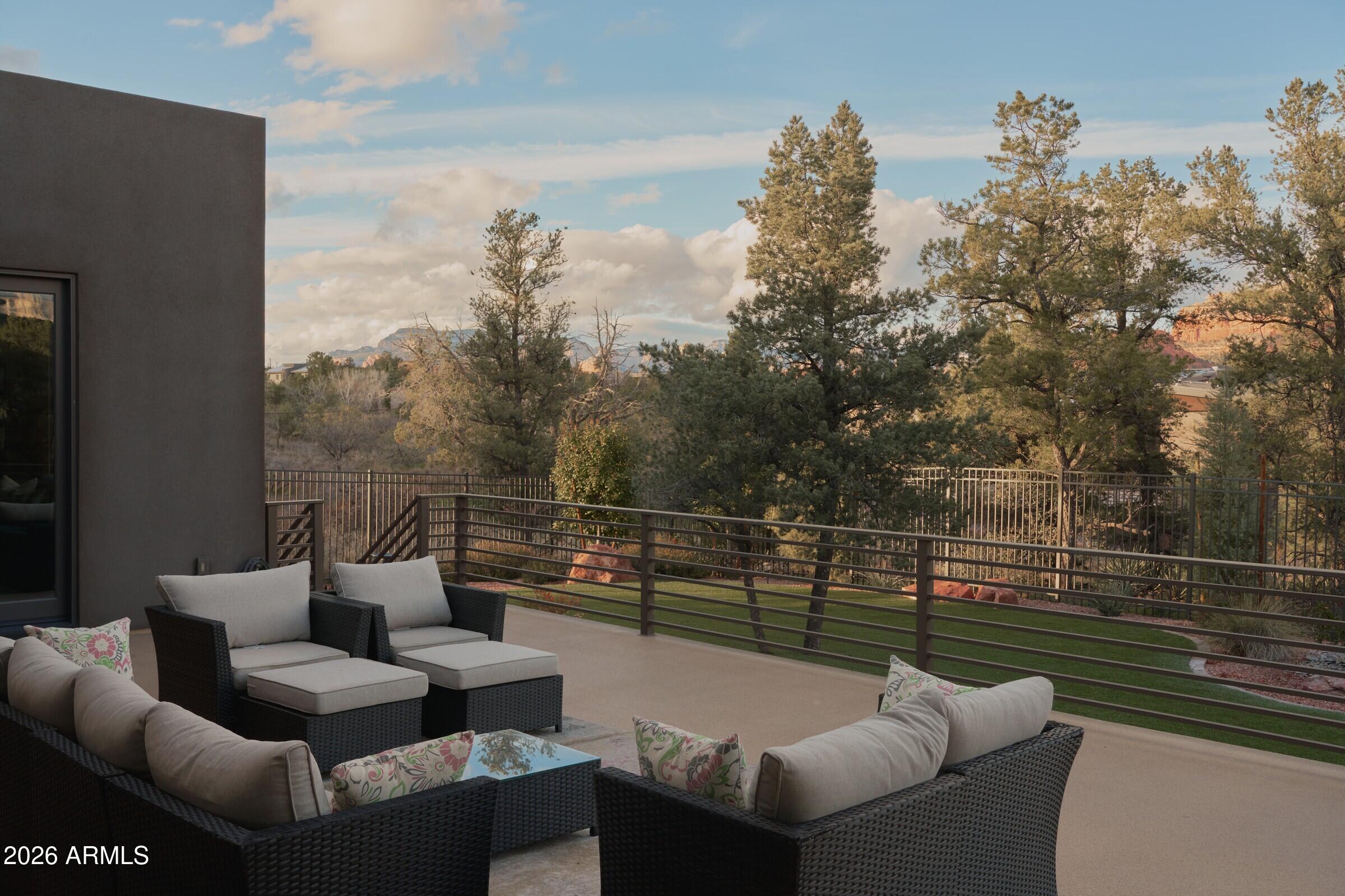 2925 Red Hawk Lane Sedona, AZ 86336 - Photo 27 of 35 a balcony with wooden floor and outdoor seating